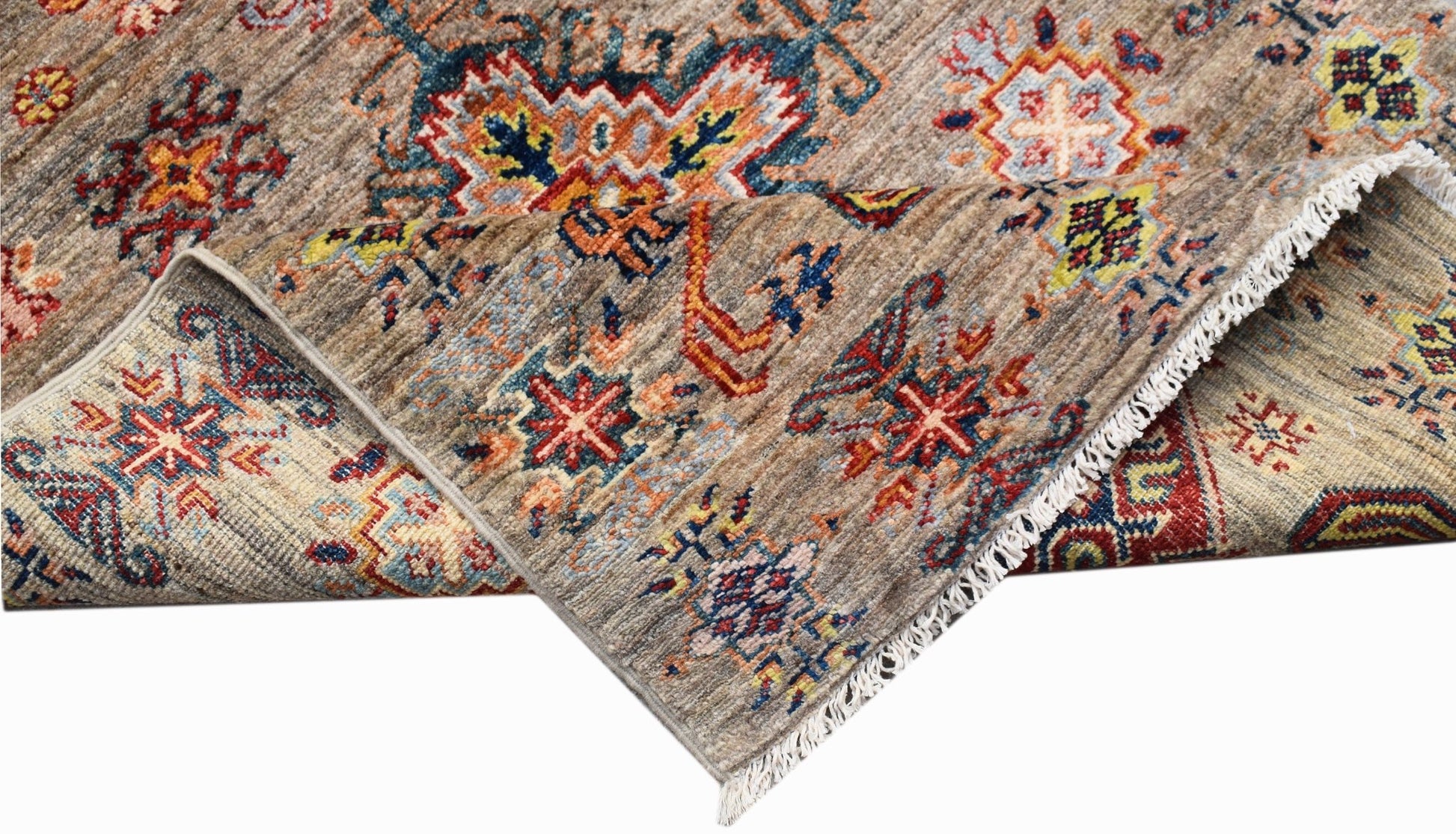 A handwoven Afghan Chobi runner featuring traditional geometric patterns in earthy tones.