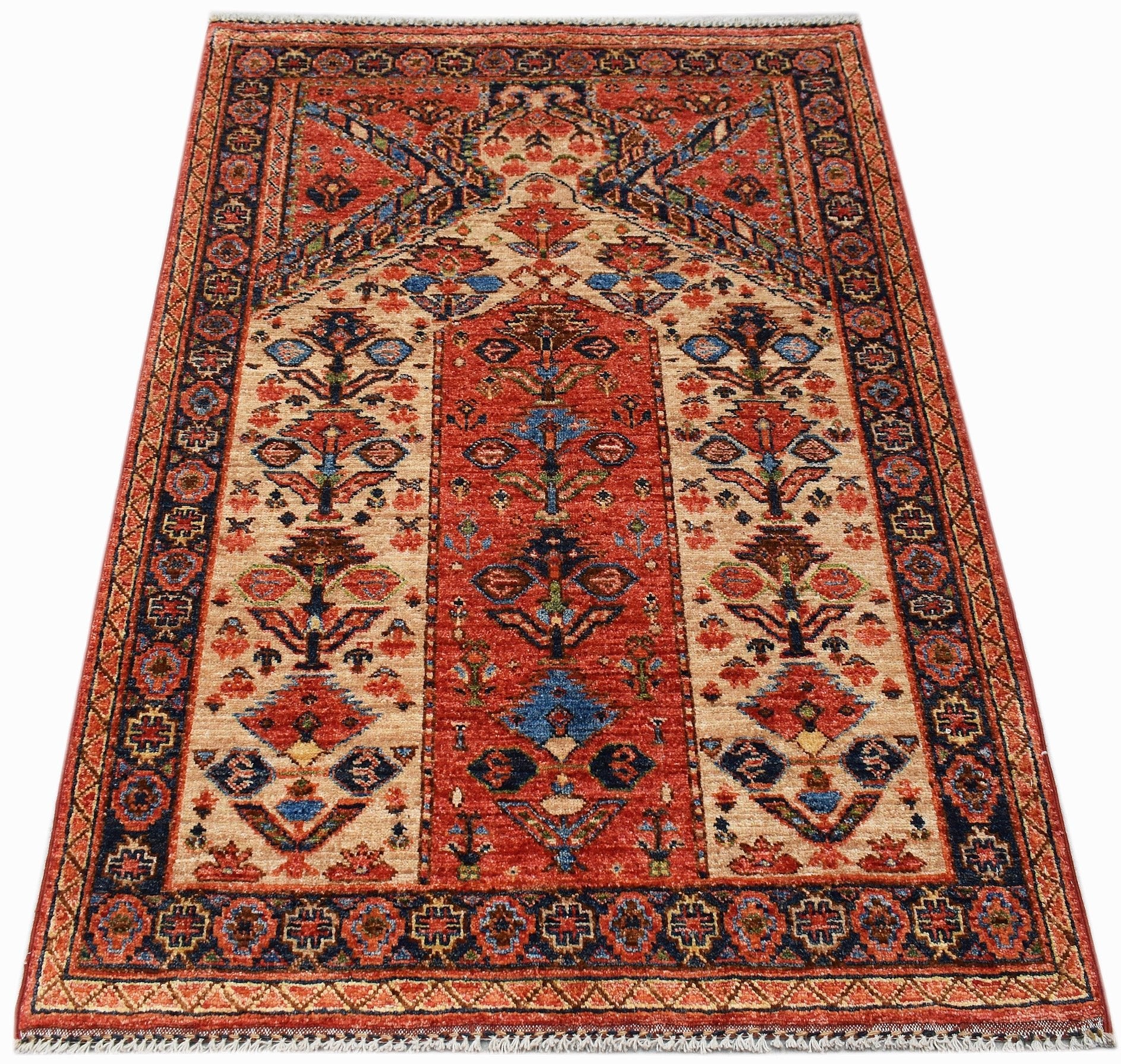 A handmade Afghan Chobi prayer rug featuring a traditional floral pattern in red and beige tones.