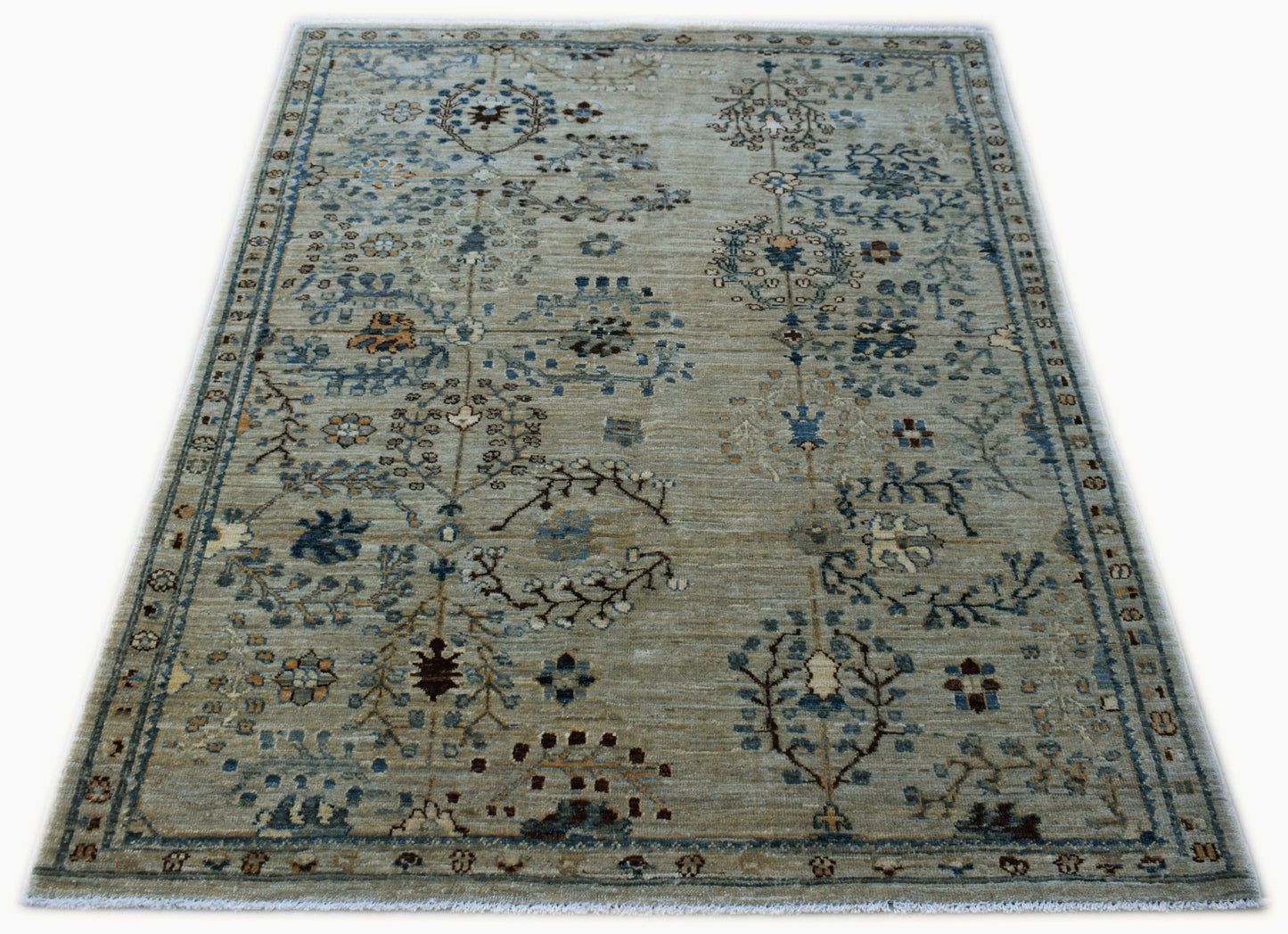 Handwoven Afghan Chobi rug featuring a traditional floral pattern in muted earth tones.