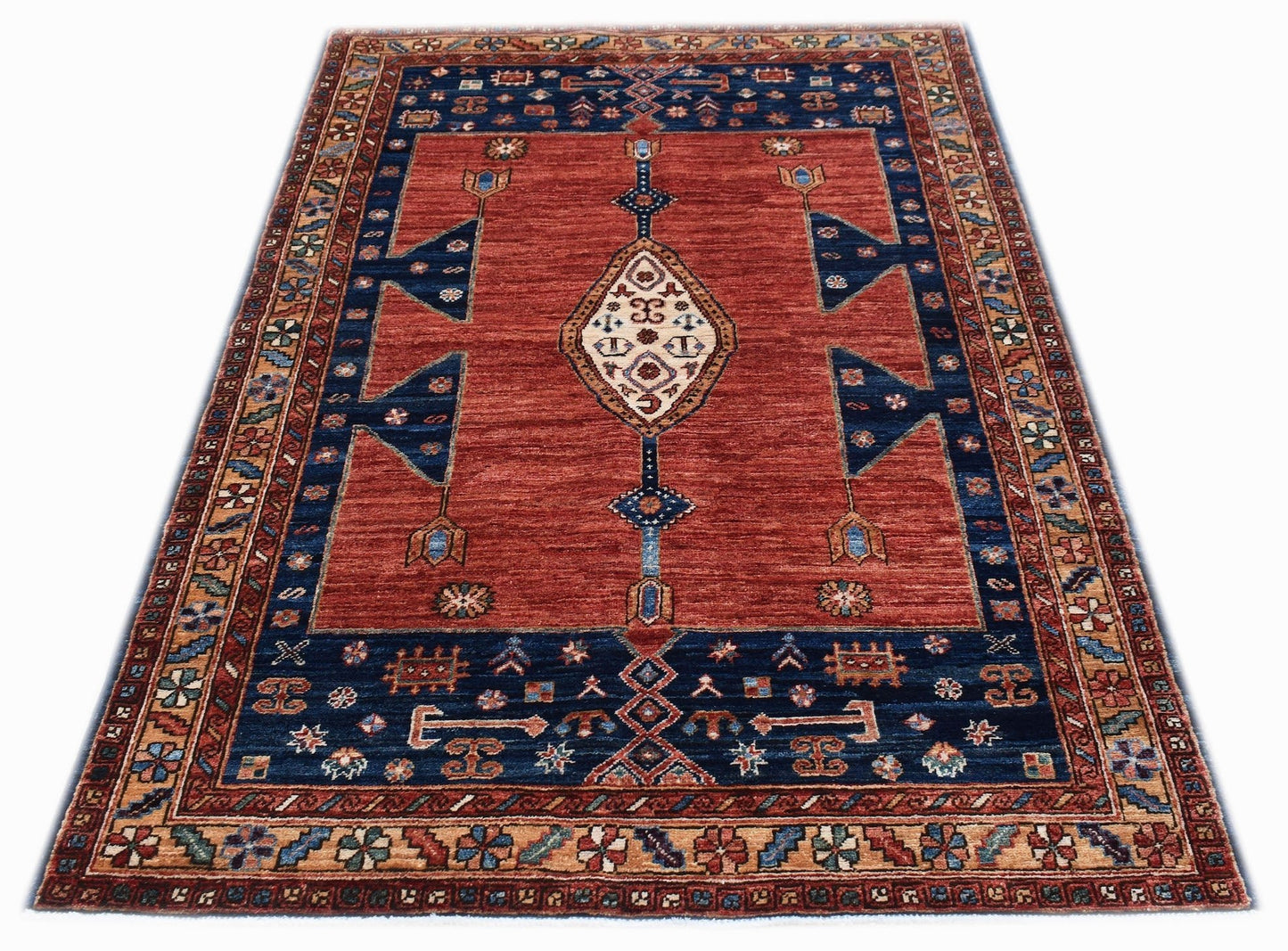 A rectangular Afghan Chobi rug featuring a central diamond medallion on a red field with blue borders.