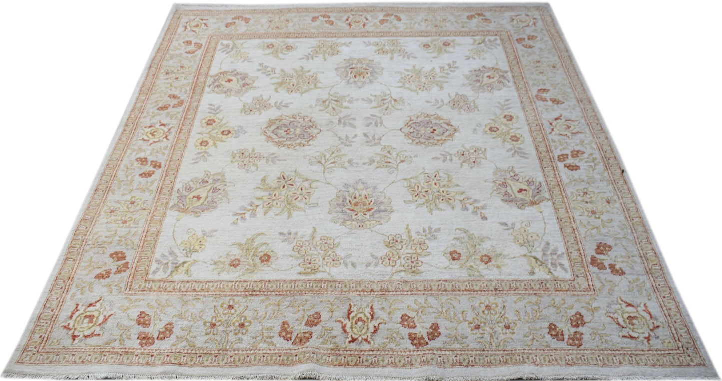 A square, handwoven Afghan Chobi rug featuring a floral pattern in soft, earthy tones.