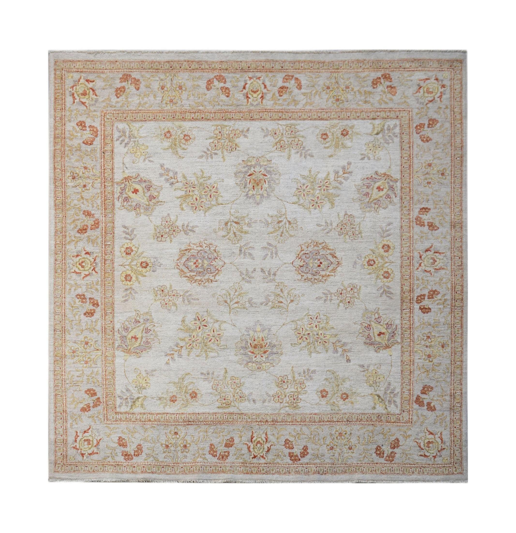 A square Afghan Chobi rug featuring a traditional floral pattern in soft wood-toned colors.