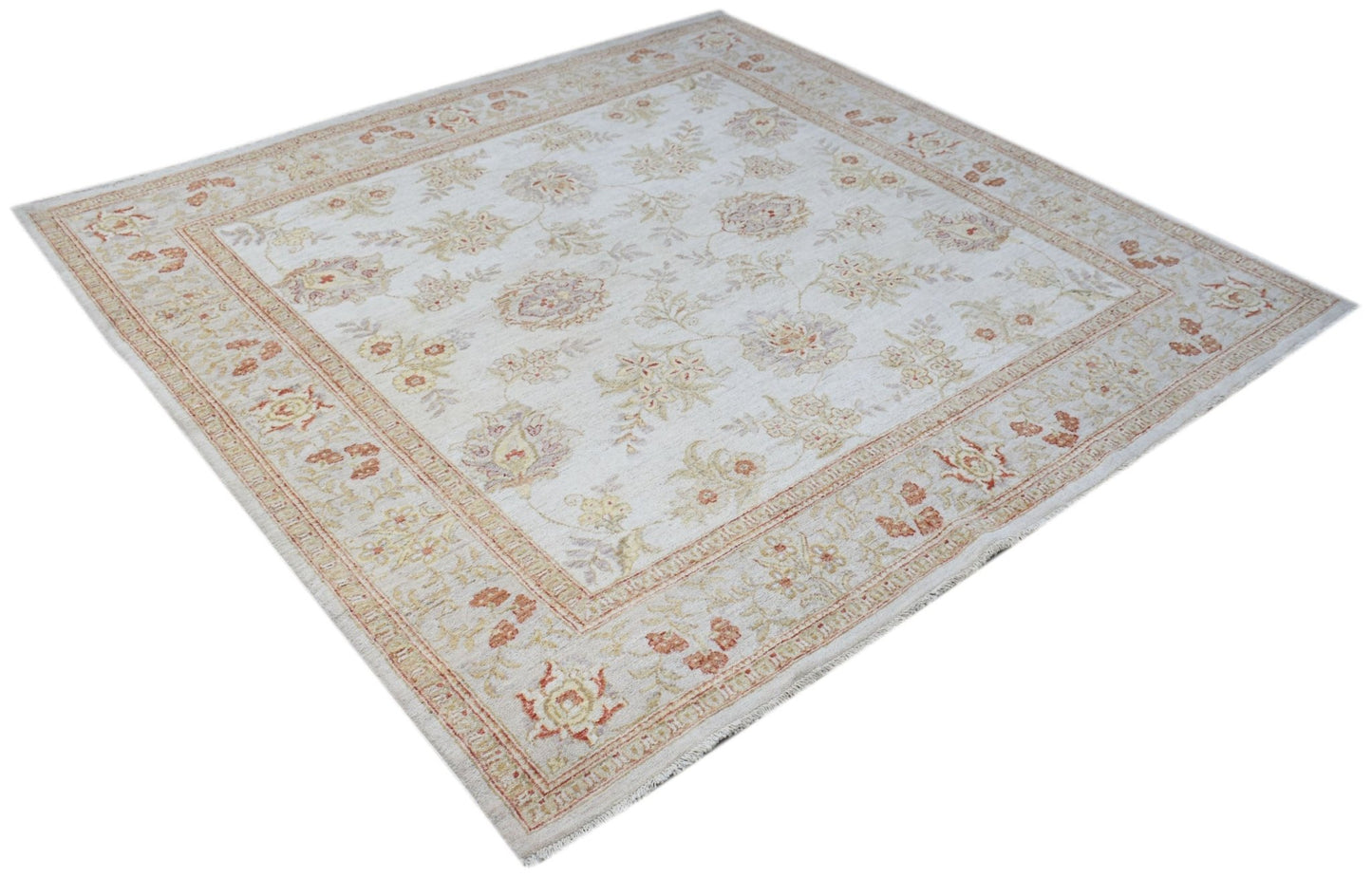 A square Afghan Chobi rug featuring a traditional floral pattern in soft, earthy tones.