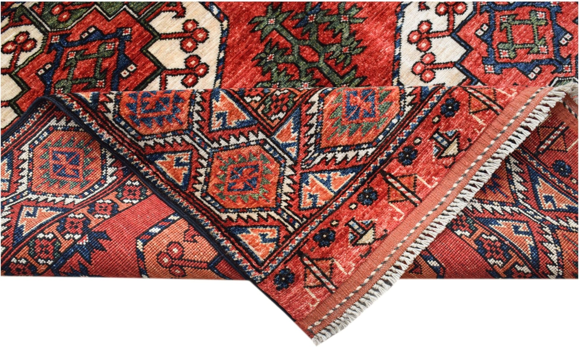 A handwoven Afghan Chobi rug featuring traditional geometric patterns in red, blue, and cream.