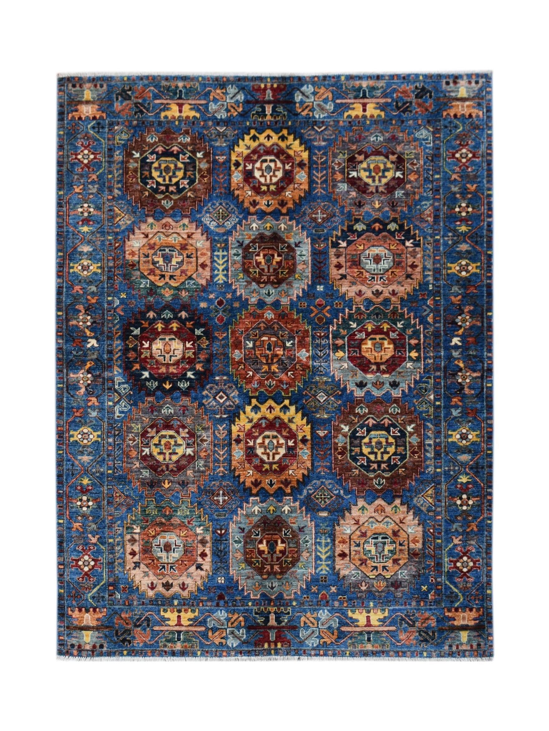 Handwoven Afghan Chobi rug featuring a geometric medallion pattern in shades of blue and earth tones.