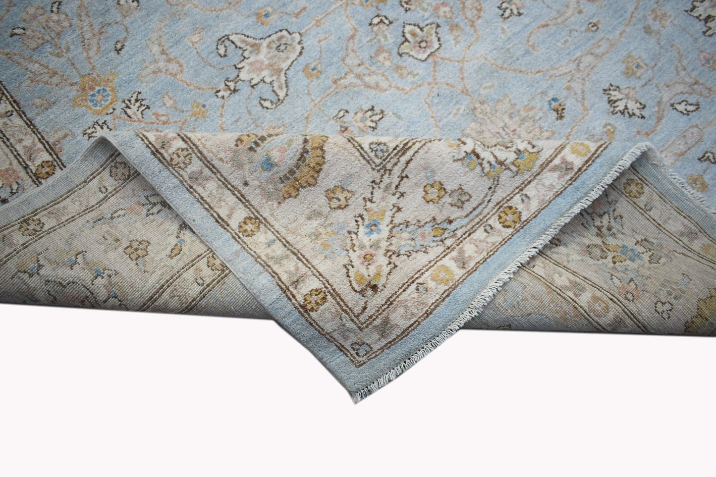 A handwoven Afghan Chobi rug featuring a light blue field with traditional floral patterns.