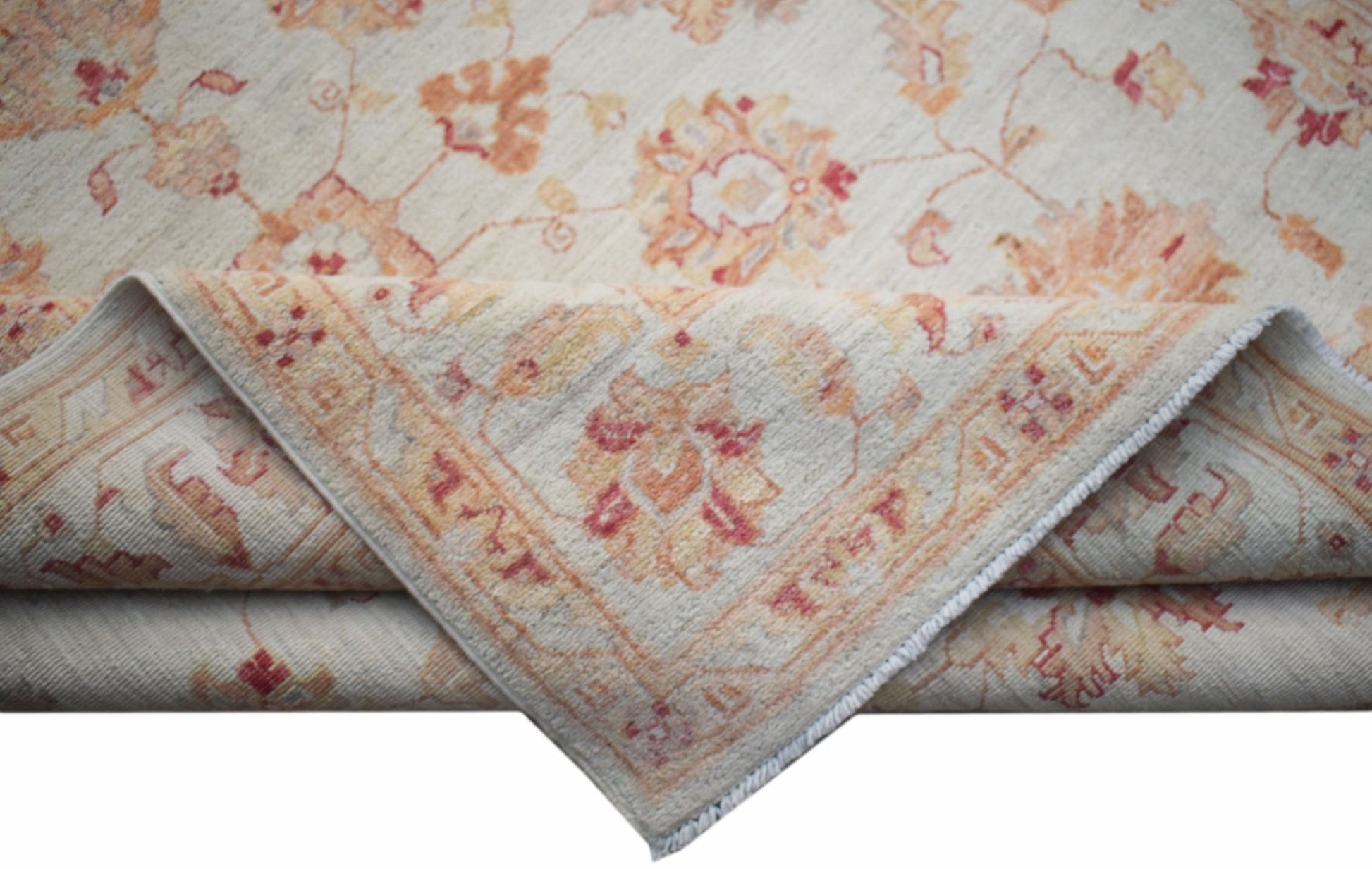 A handwoven Afghan Chobi rug featuring a traditional floral pattern in soft orange and cream tones.