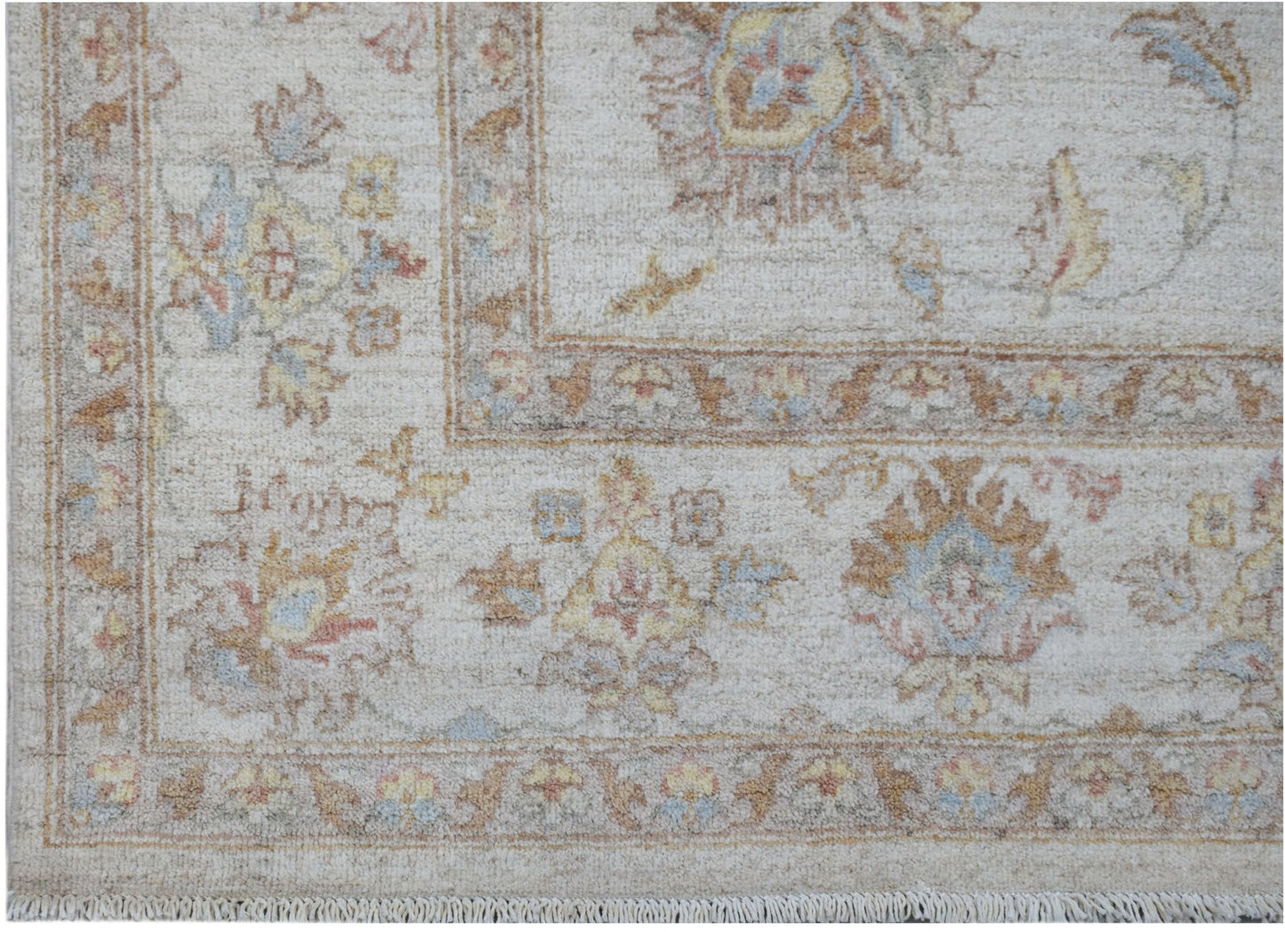 A handmade Afghan Chobi rug featuring a traditional floral pattern in soft, earthy tones.