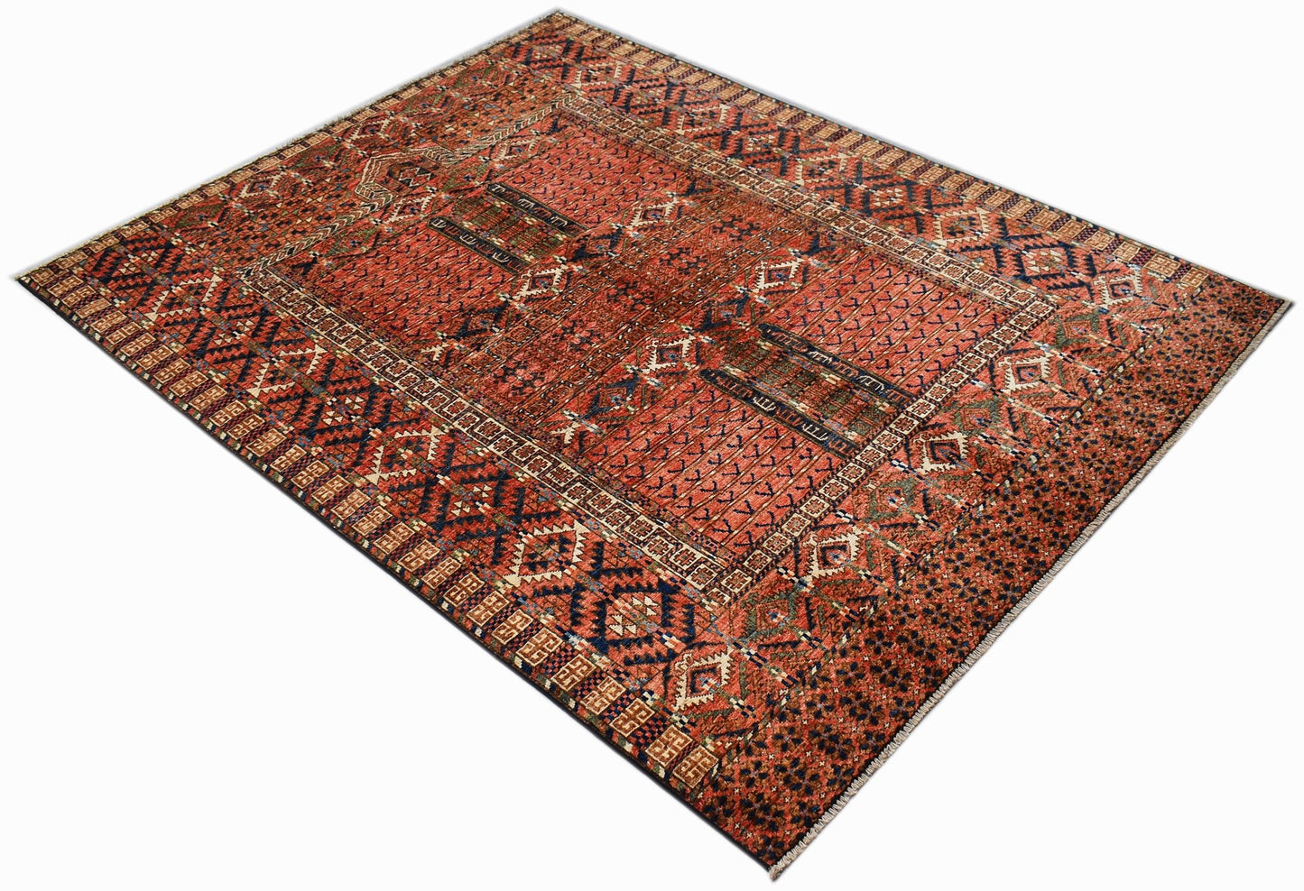 A rectangular Afghan Chobi rug featuring traditional geometric patterns in warm earthy tones.