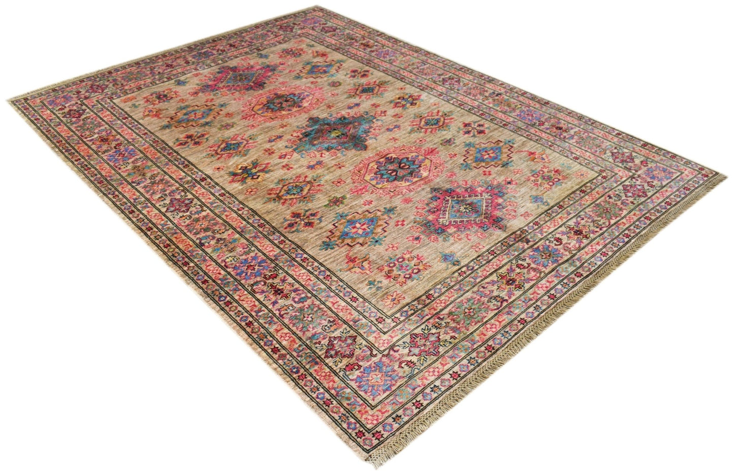An Afghan Super Kazakh rug featuring a traditional geometric pattern in muted earth tones.