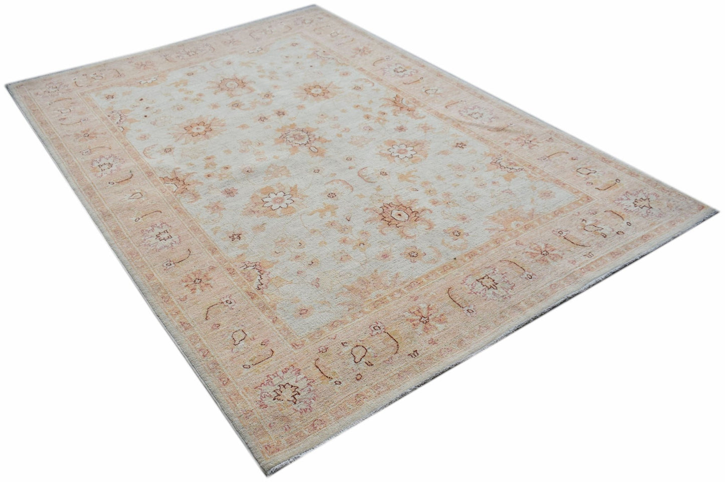 A rectangular Afghan Chobi rug featuring a traditional floral pattern in soft beige and peach tones.