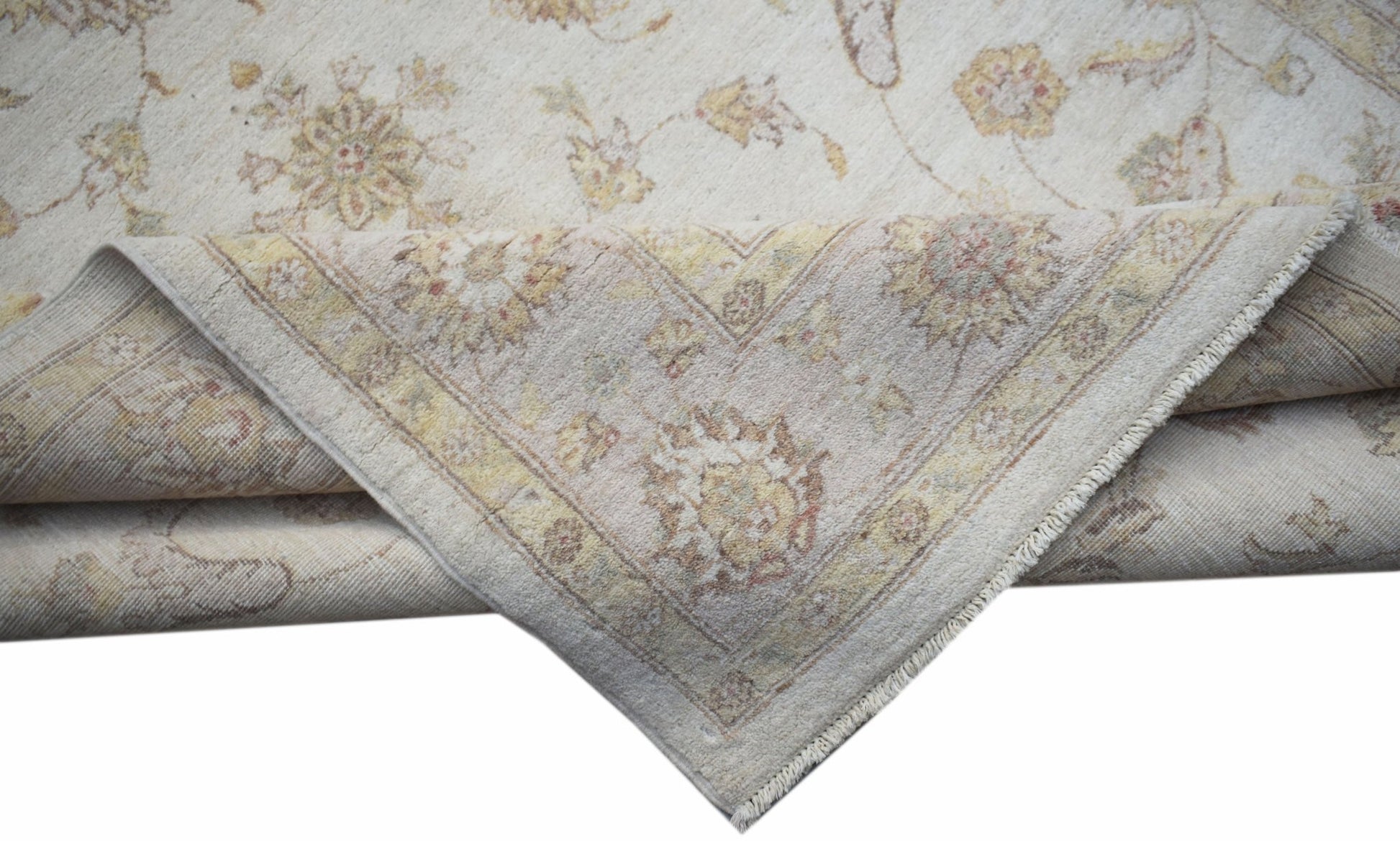 A handwoven Afghan Chobi rug featuring a traditional floral pattern in soft, earthy tones.