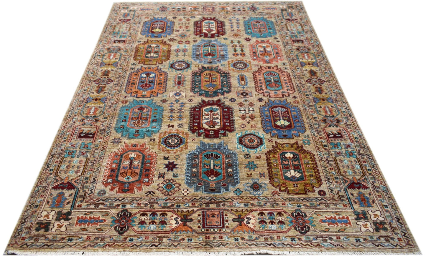 An Afghan Chobi rug featuring a traditional geometric pattern in vibrant colors on a tan background.