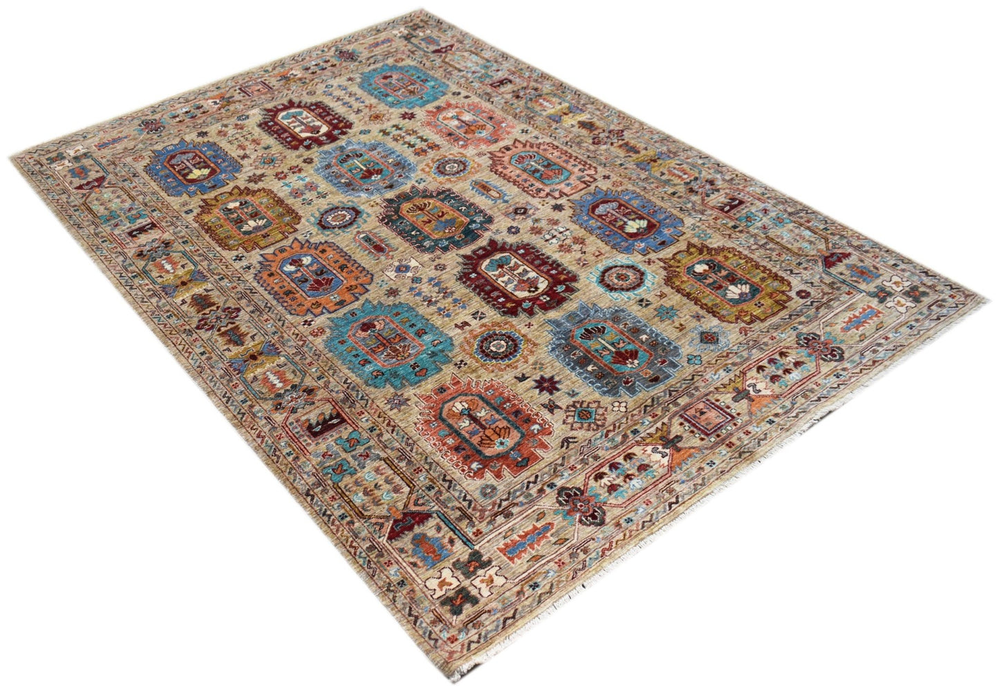 A rectangular Afghan Chobi rug featuring a traditional geometric pattern in earthy, muted tones.