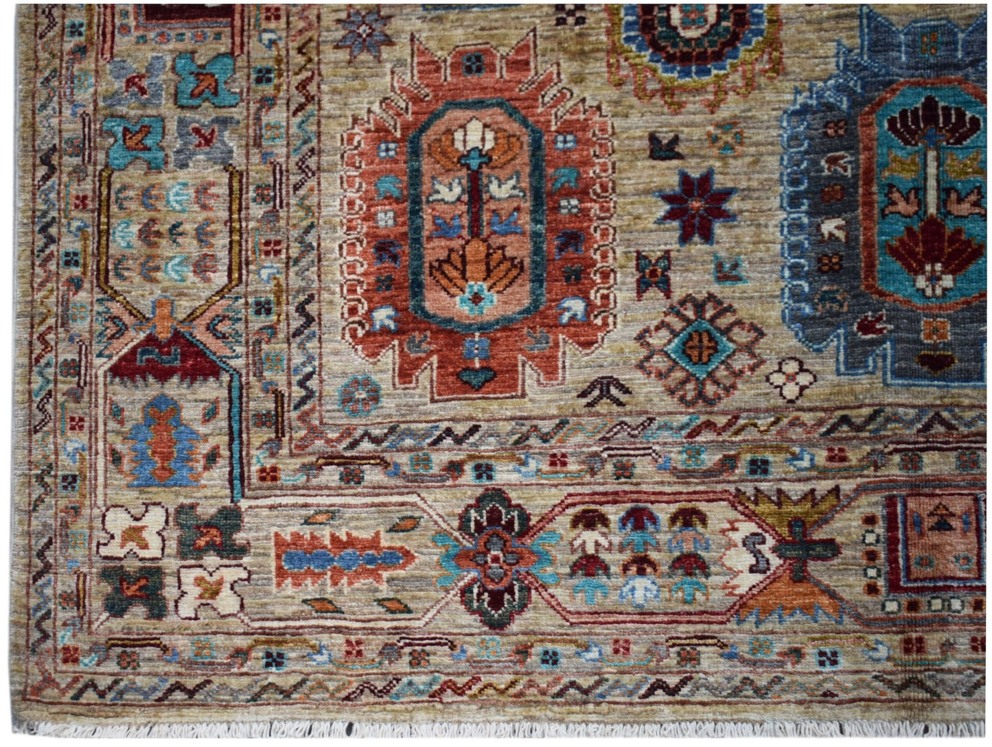 Handwoven Afghan Chobi rug featuring intricate geometric patterns in earthy, muted tones.