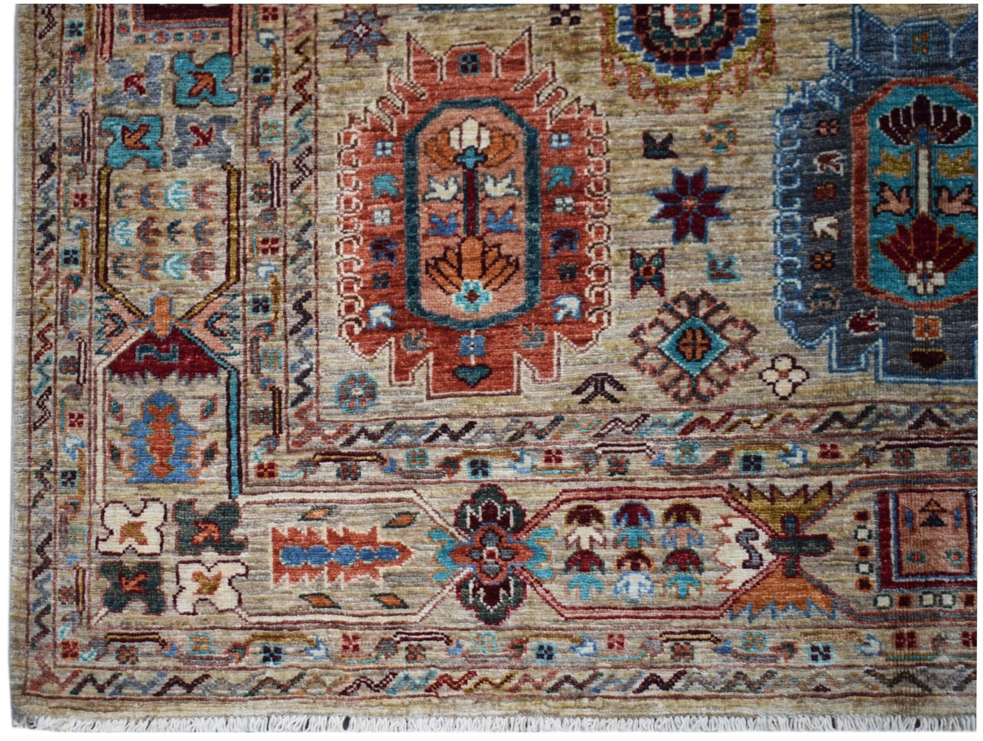 Handwoven Afghan Chobi rug featuring intricate geometric patterns in earthy, muted tones.