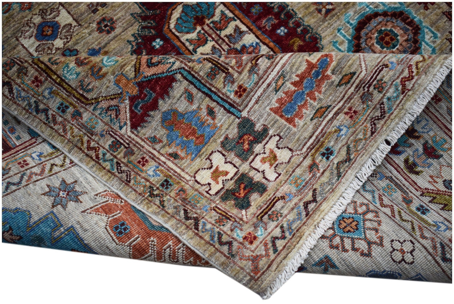 A handwoven Afghan Chobi rug featuring intricate traditional patterns in earthy, vibrant tones.