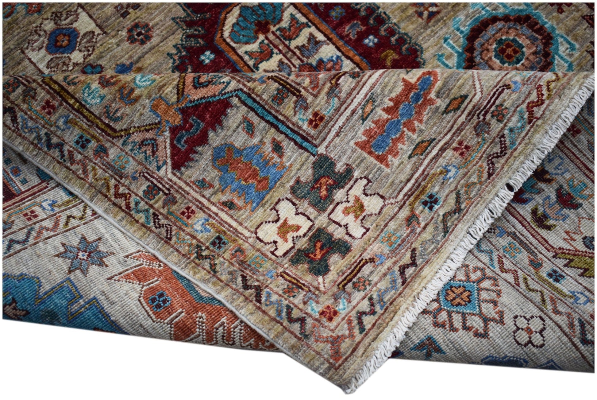 A handwoven Afghan Chobi rug featuring intricate traditional patterns in earthy, vibrant tones.