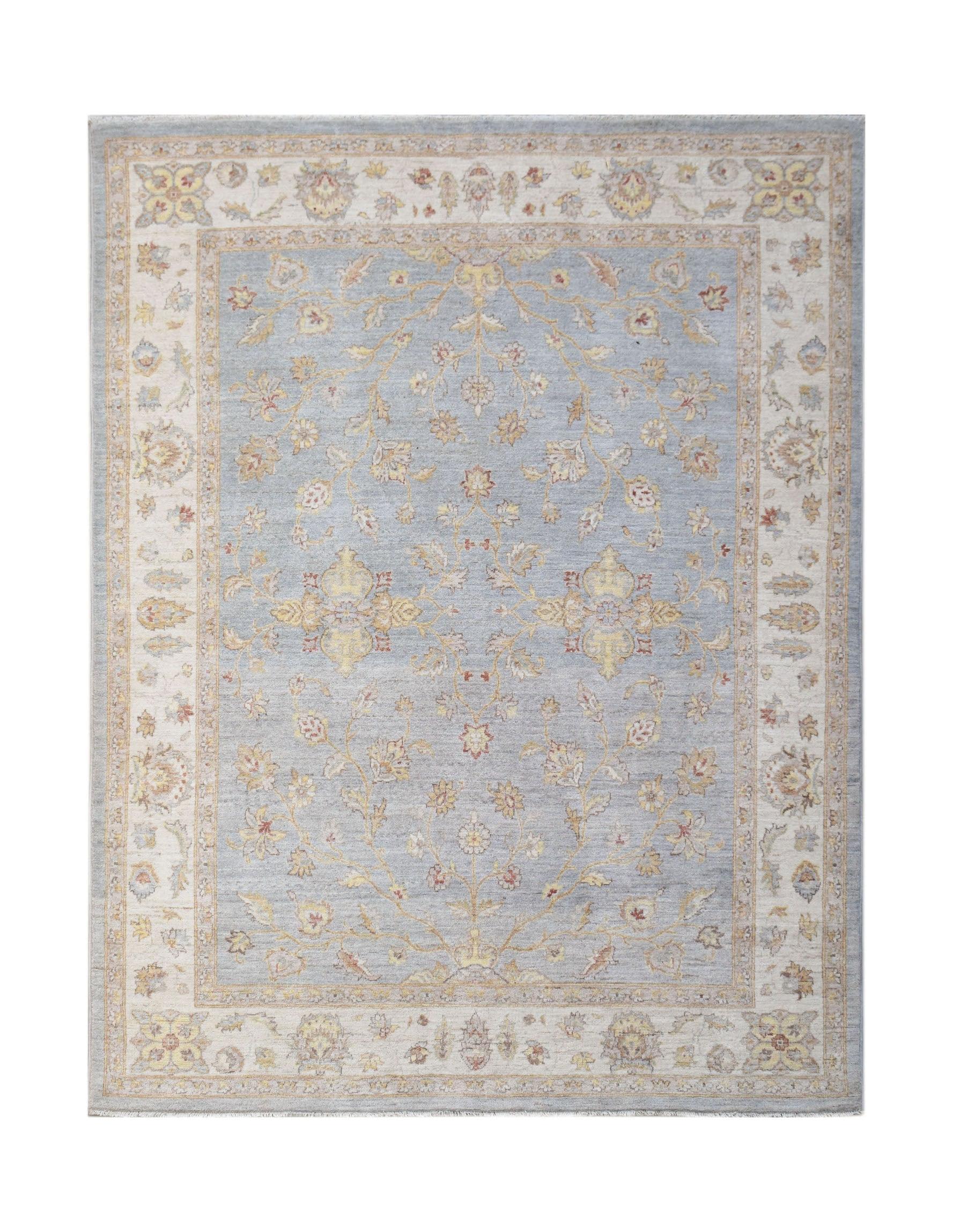 A handwoven Afghan Chobi rug featuring a light blue field with intricate floral patterns.