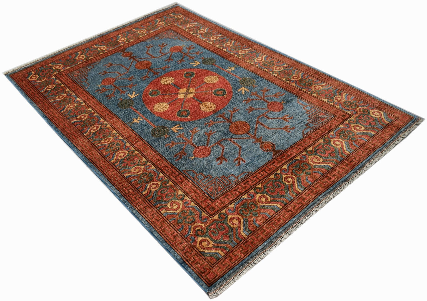 A rectangular Afghan Chobi rug featuring a central red medallion on a blue field with floral motifs.