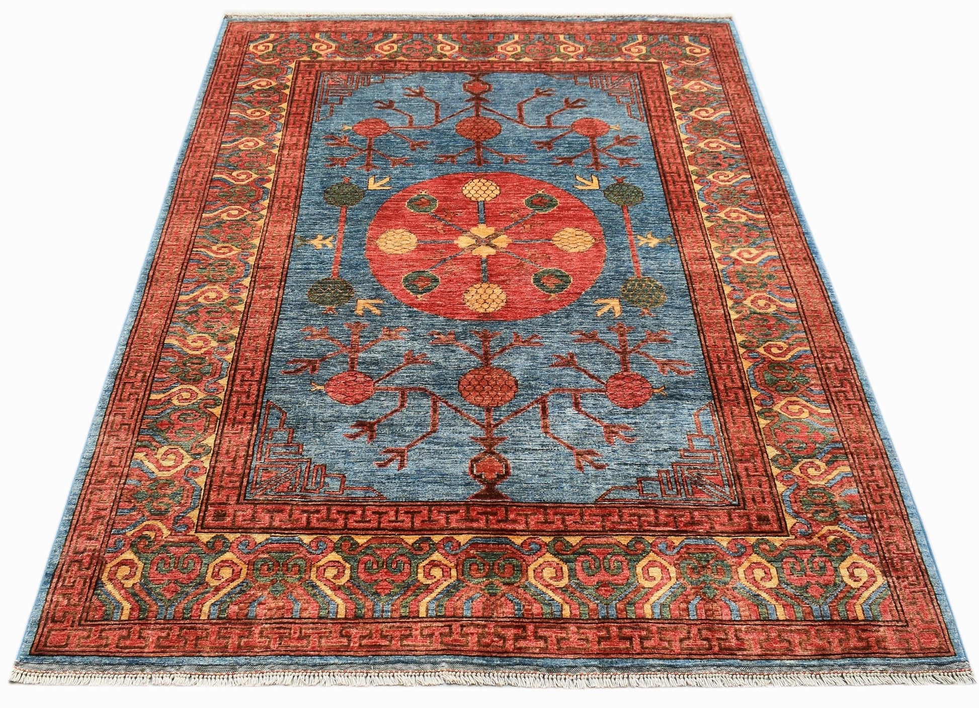A rectangular Afghan Chobi rug featuring a blue field with a central red medallion and floral motifs.