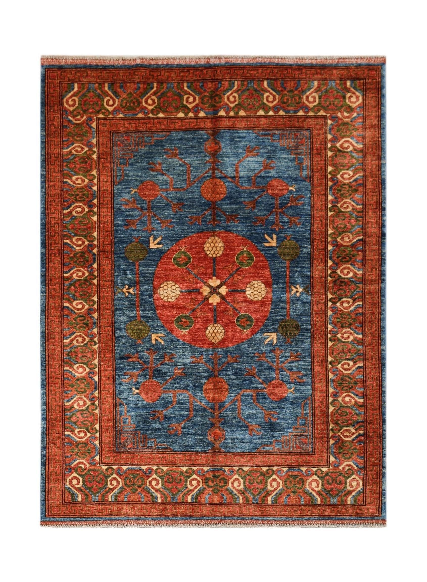 Handwoven Afghan Chobi rug featuring a central red medallion on a blue field with floral motifs.