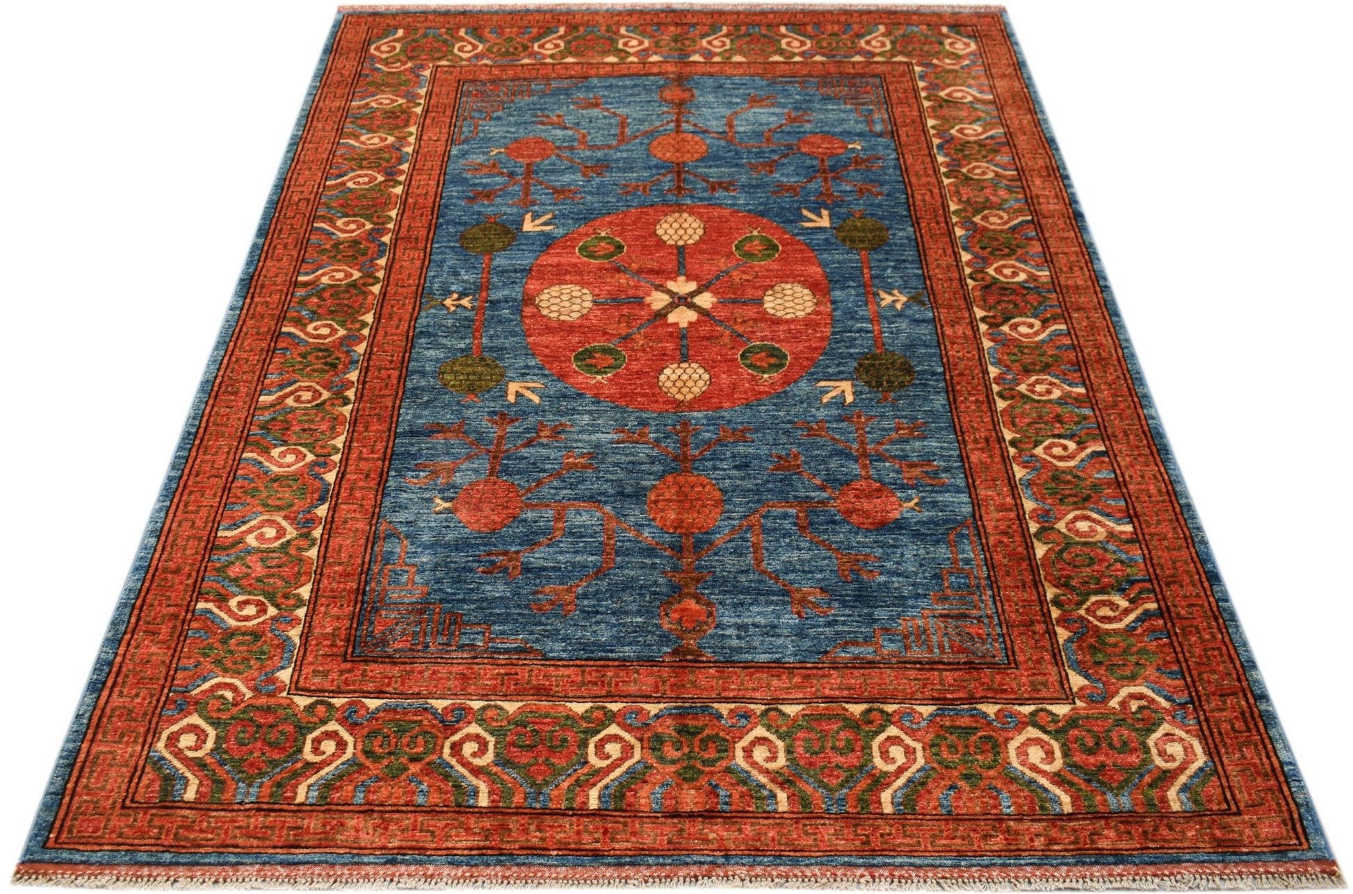 A rectangular Afghan Chobi rug featuring a central red medallion on a blue field with floral motifs.