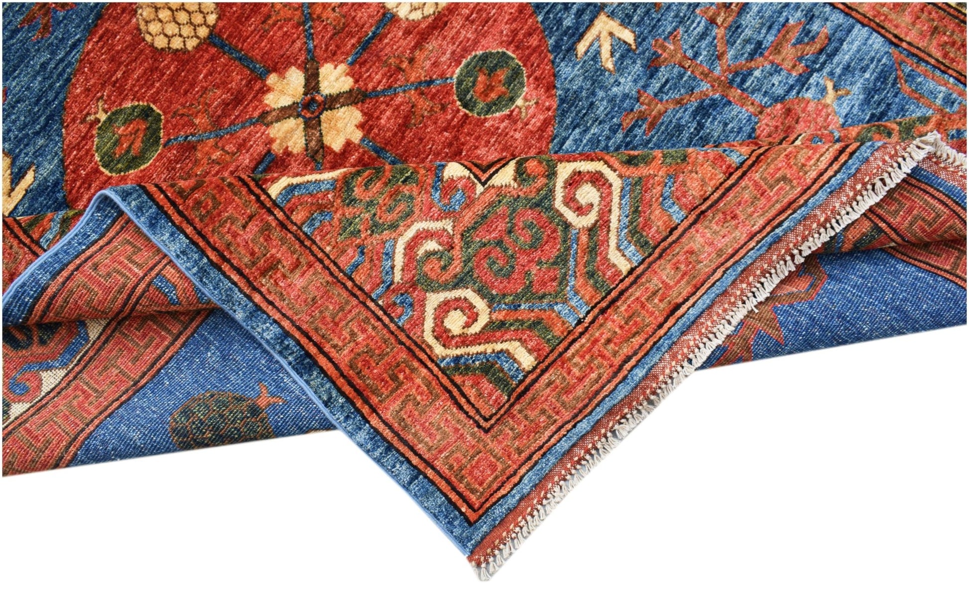 A handwoven Afghan Chobi rug featuring a blue field with red circular motifs and a geometric border.