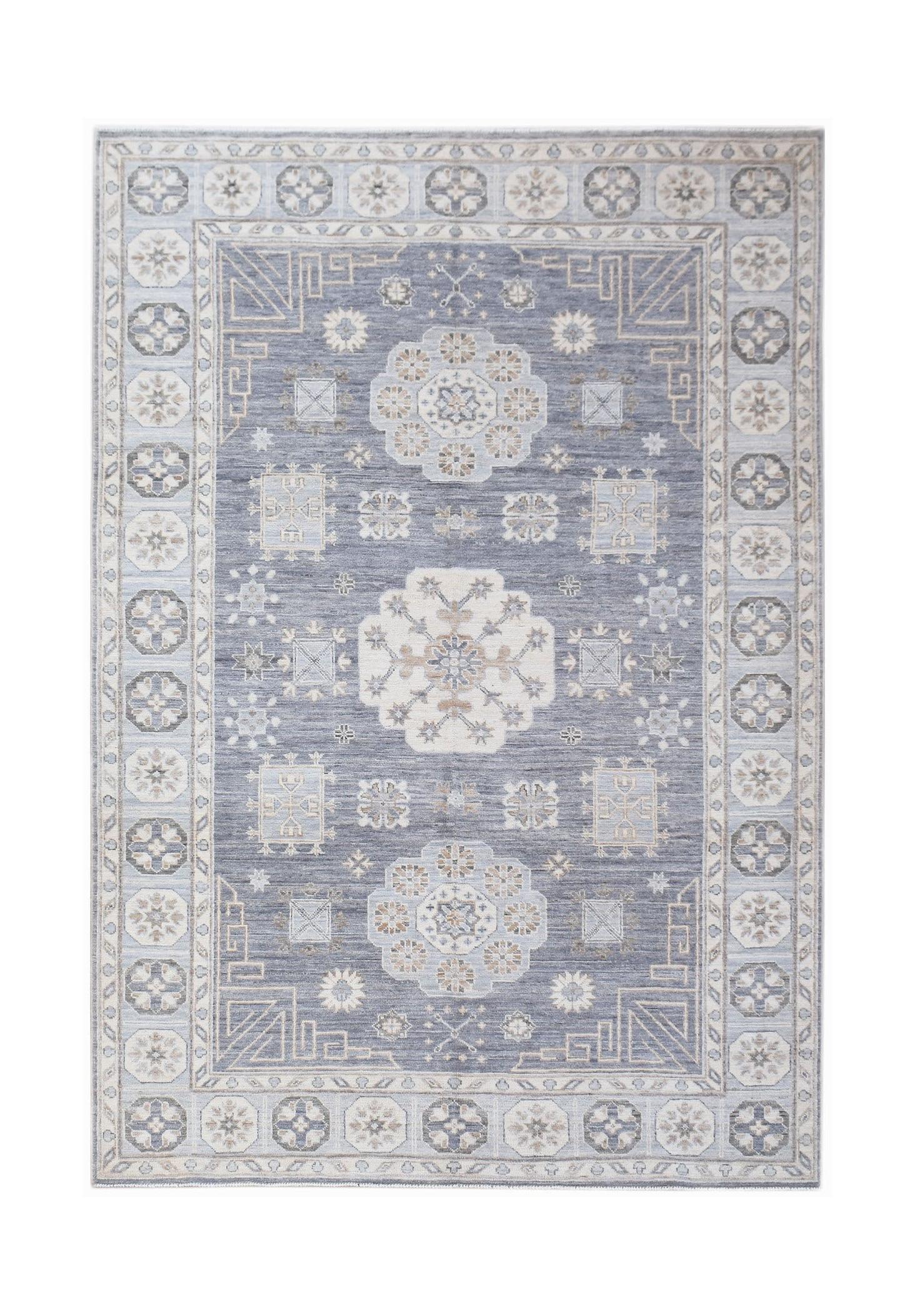 A rectangular Afghan Chobi rug featuring a blue field with traditional floral and geometric motifs.