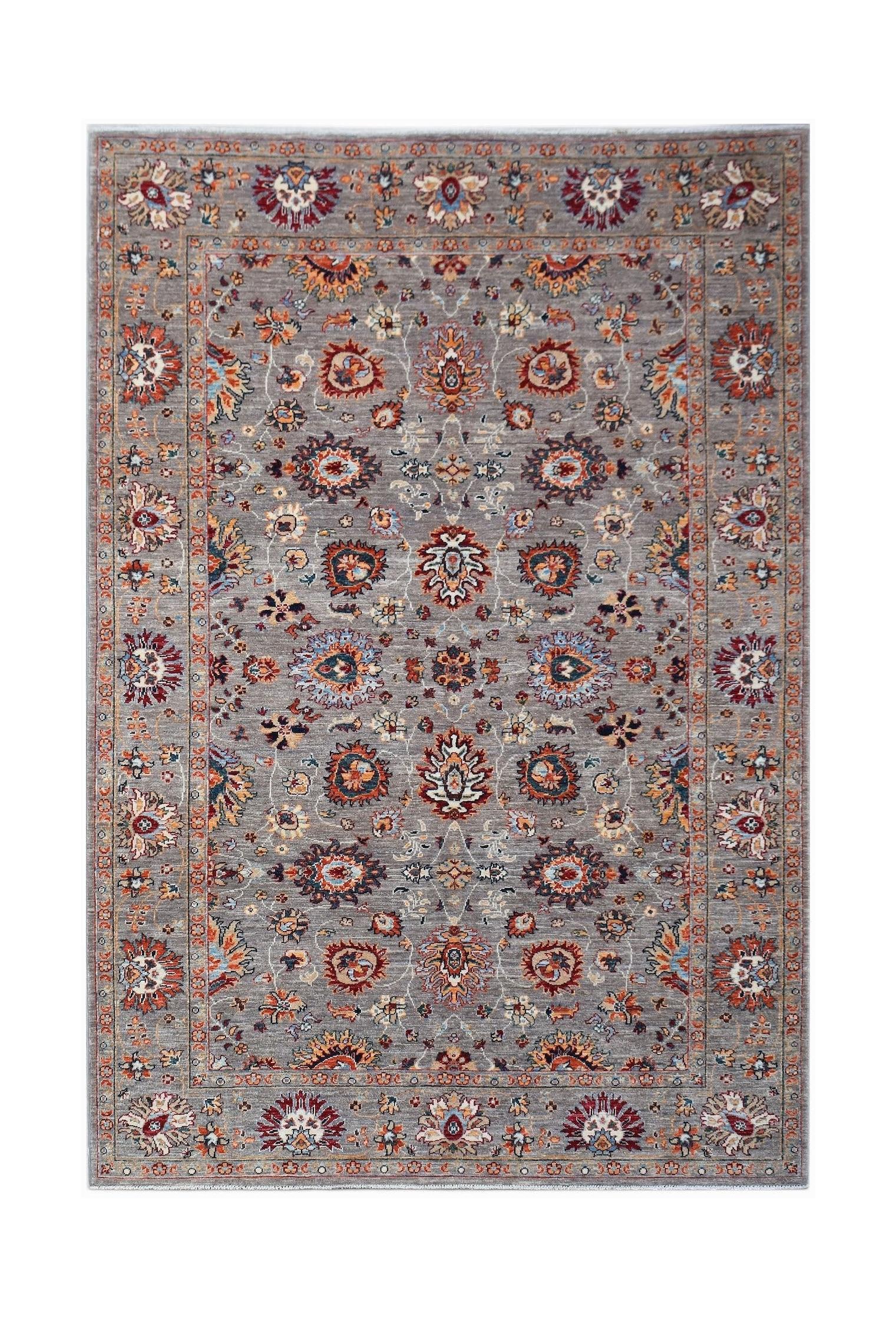 A rectangular Afghan Chobi rug featuring a traditional floral pattern in muted earth tones.