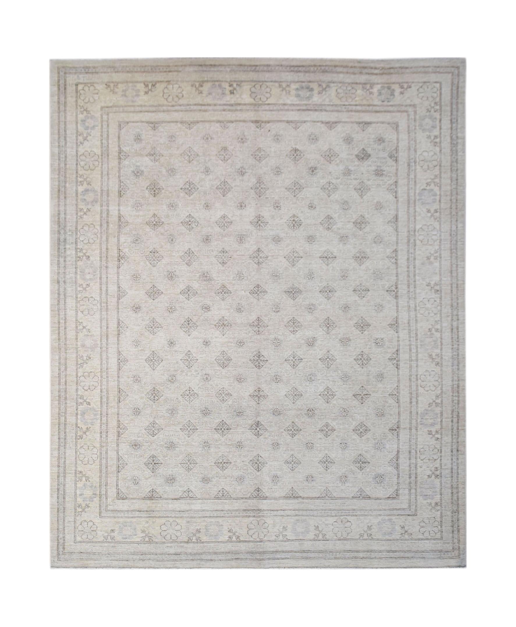 A handmade Afghan Chobi rug featuring a light beige field with a repeating geometric diamond pattern.