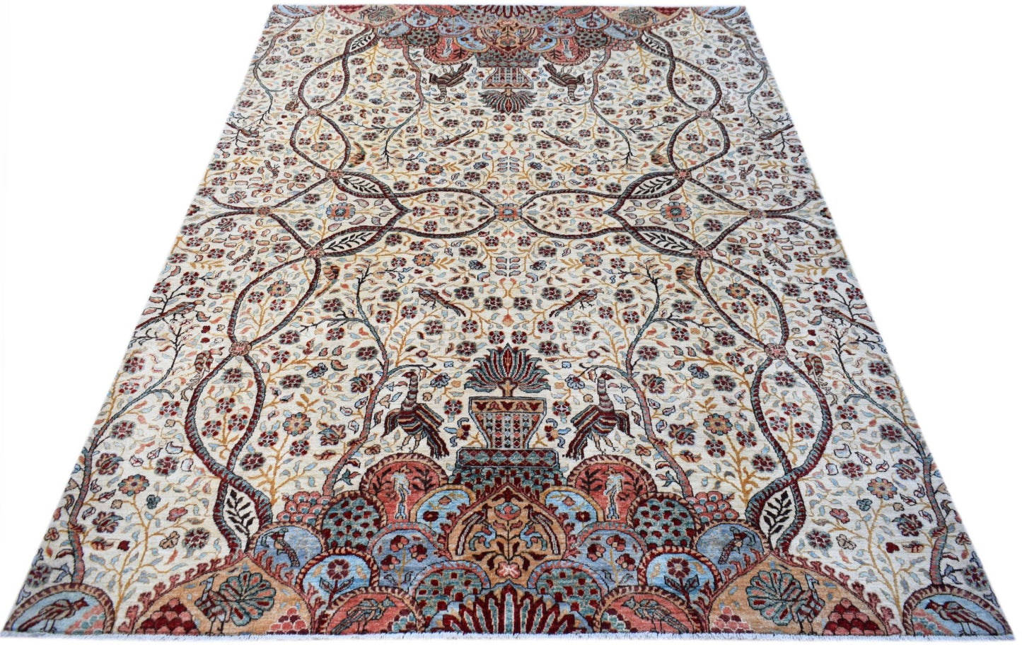 An Afghan Chobi rug featuring a traditional floral and bird pattern in soft, earthy tones.