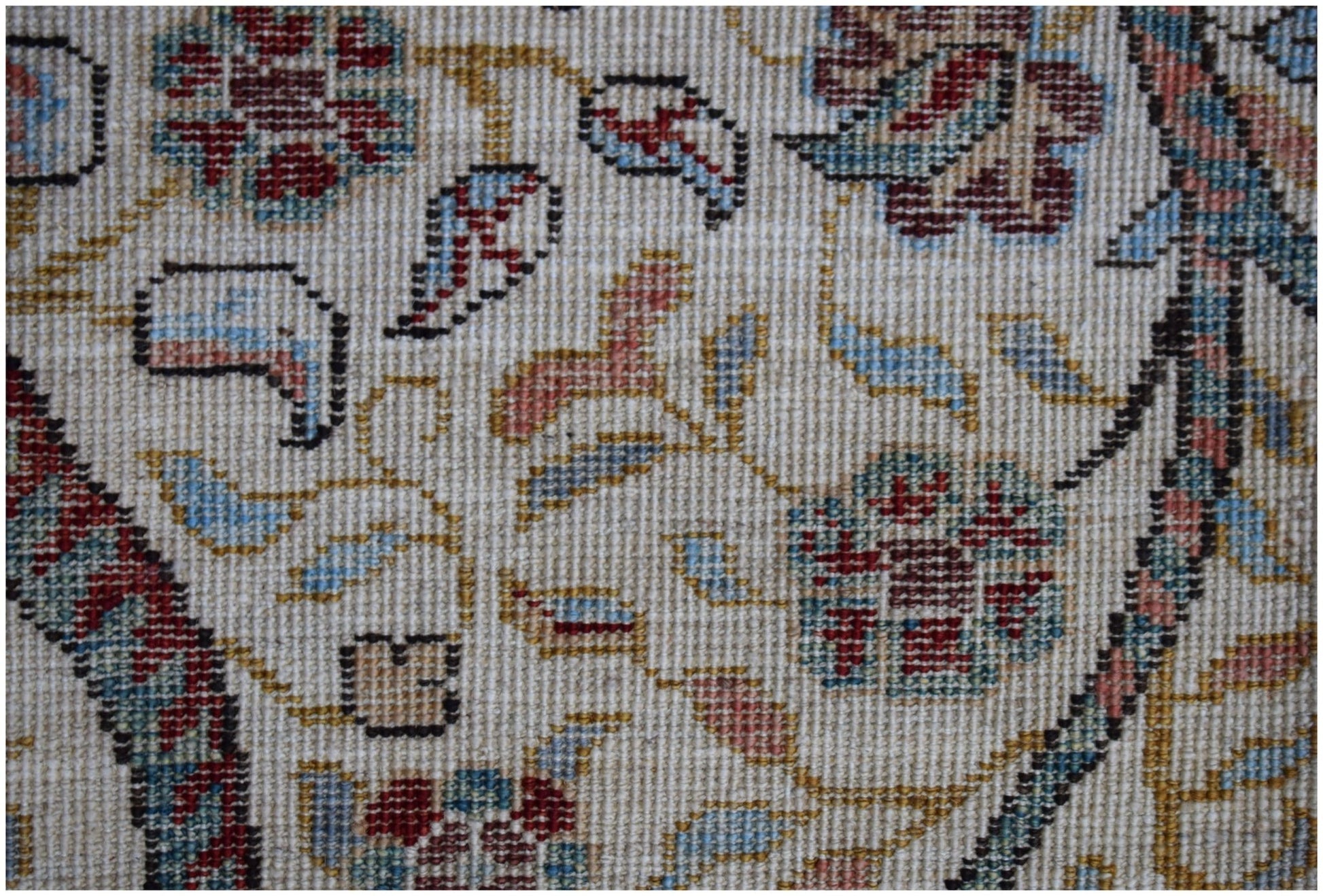 A close-up of a handwoven Afghan Chobi rug featuring intricate floral patterns in earthy tones.