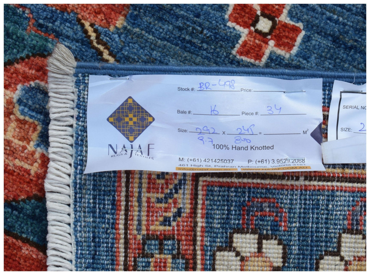 A hand-knotted Afghan Chobi rug featuring a traditional blue and red patterned design.