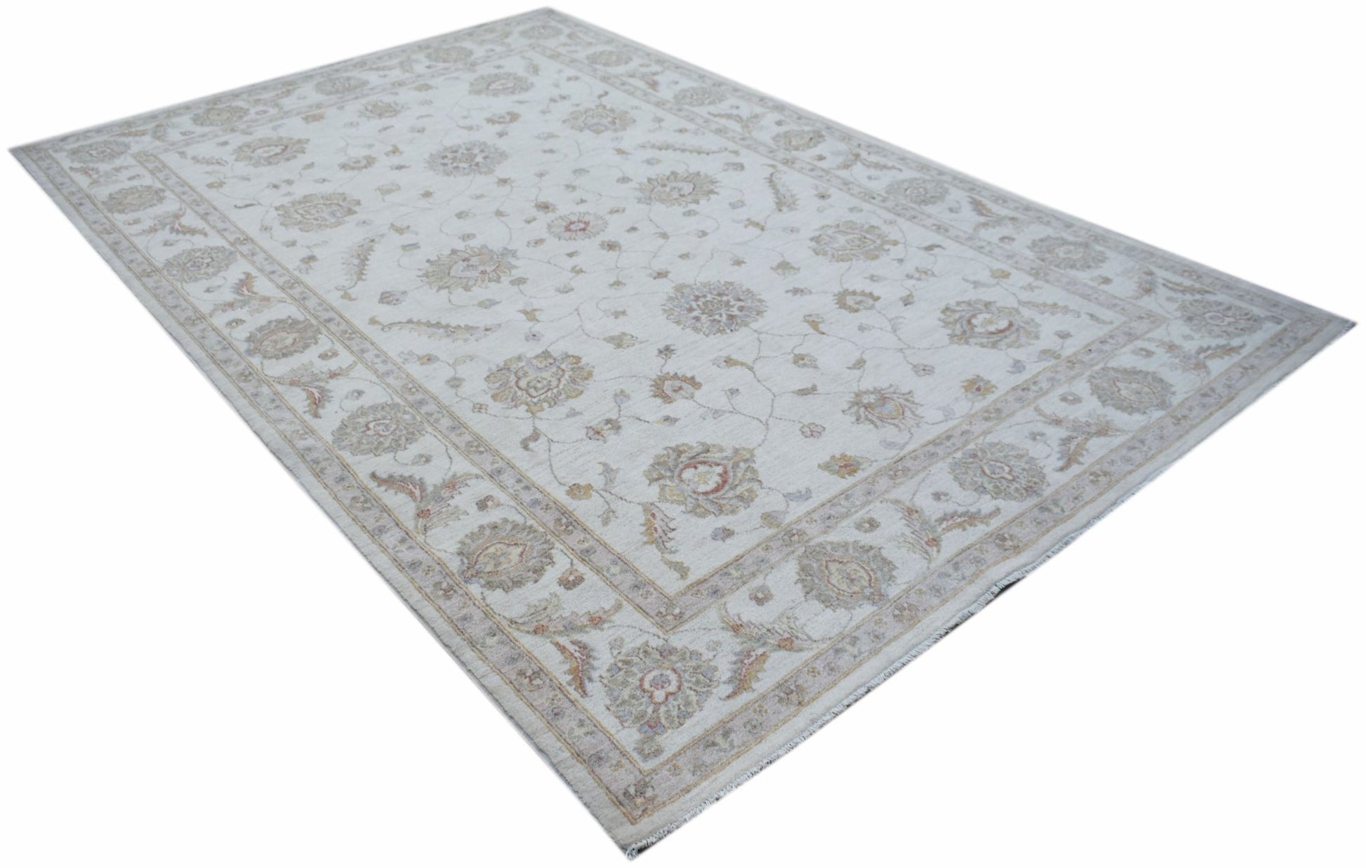 An Afghan Chobi rug featuring a traditional floral pattern in soft, neutral earth tones.