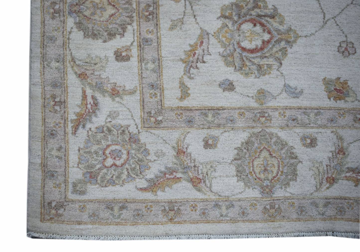 A handmade Afghan Chobi rug featuring traditional floral patterns in soft, earthy tones.