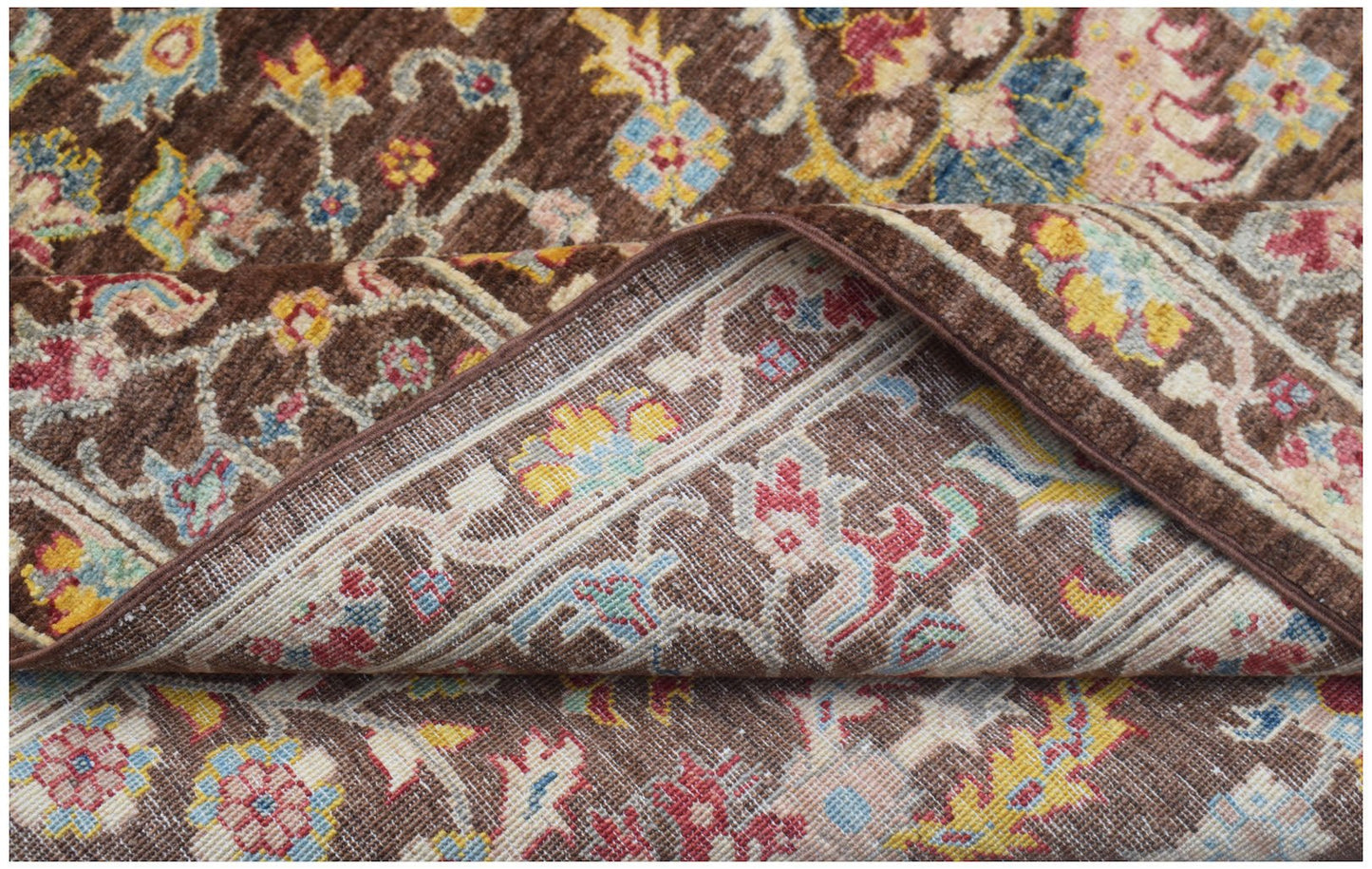 A handwoven Afghan Chobi rug featuring a traditional floral pattern in brown, red, and yellow.