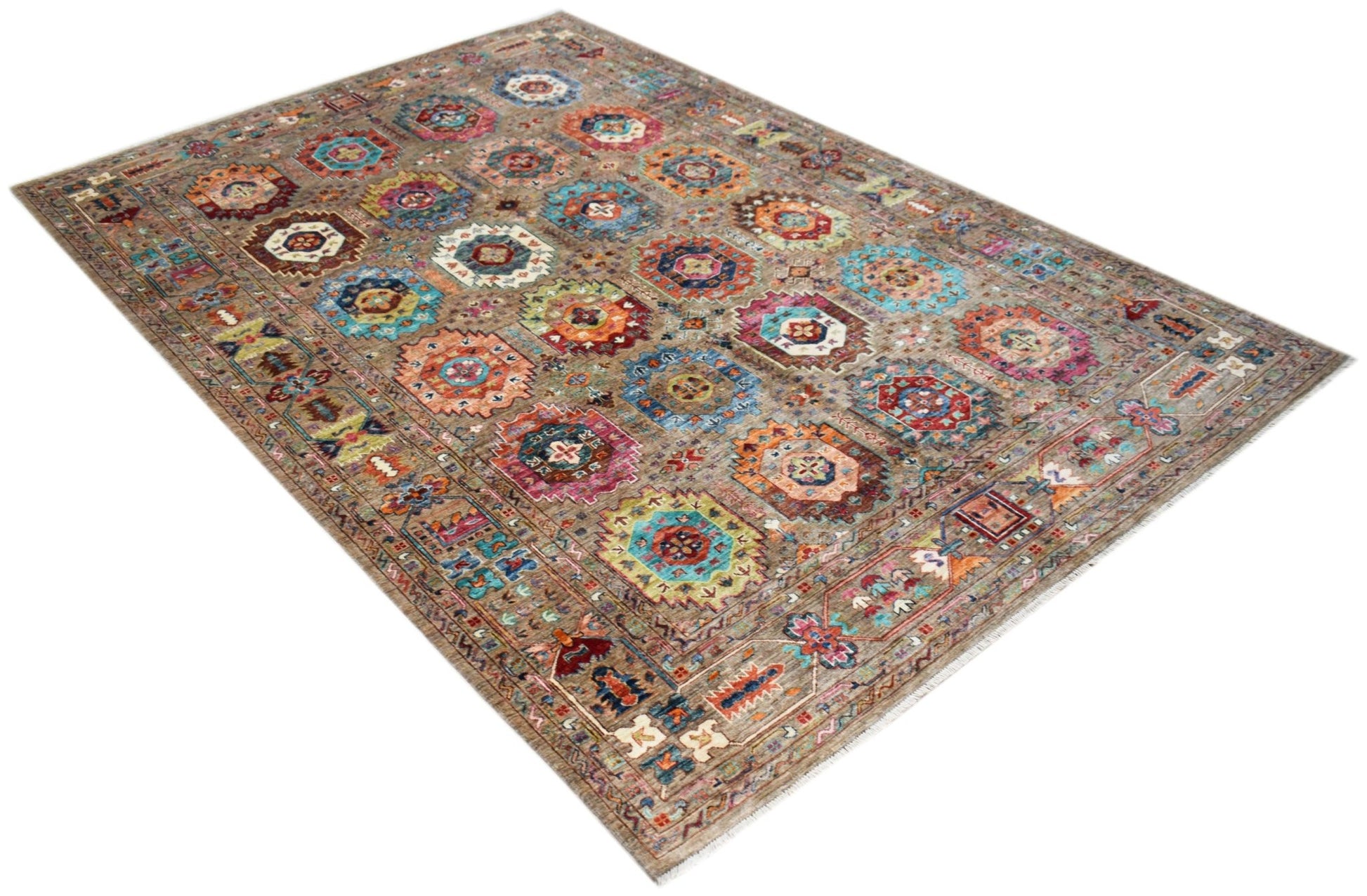 Handwoven Afghan Chobi rug featuring a traditional geometric pattern in earthy, vibrant tones.