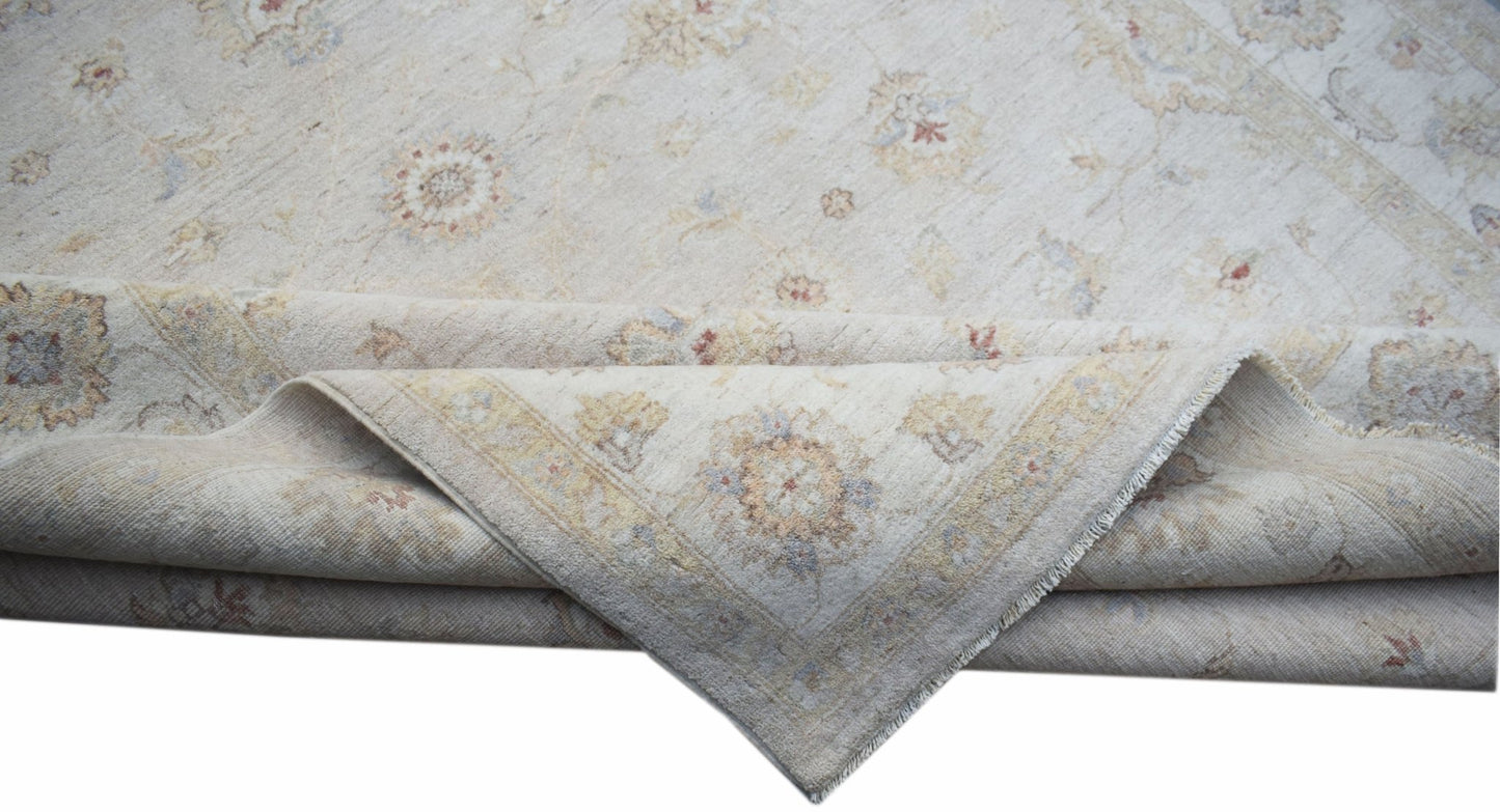 A handwoven Afghan Chobi rug featuring a traditional floral pattern in soft, neutral wood tones.