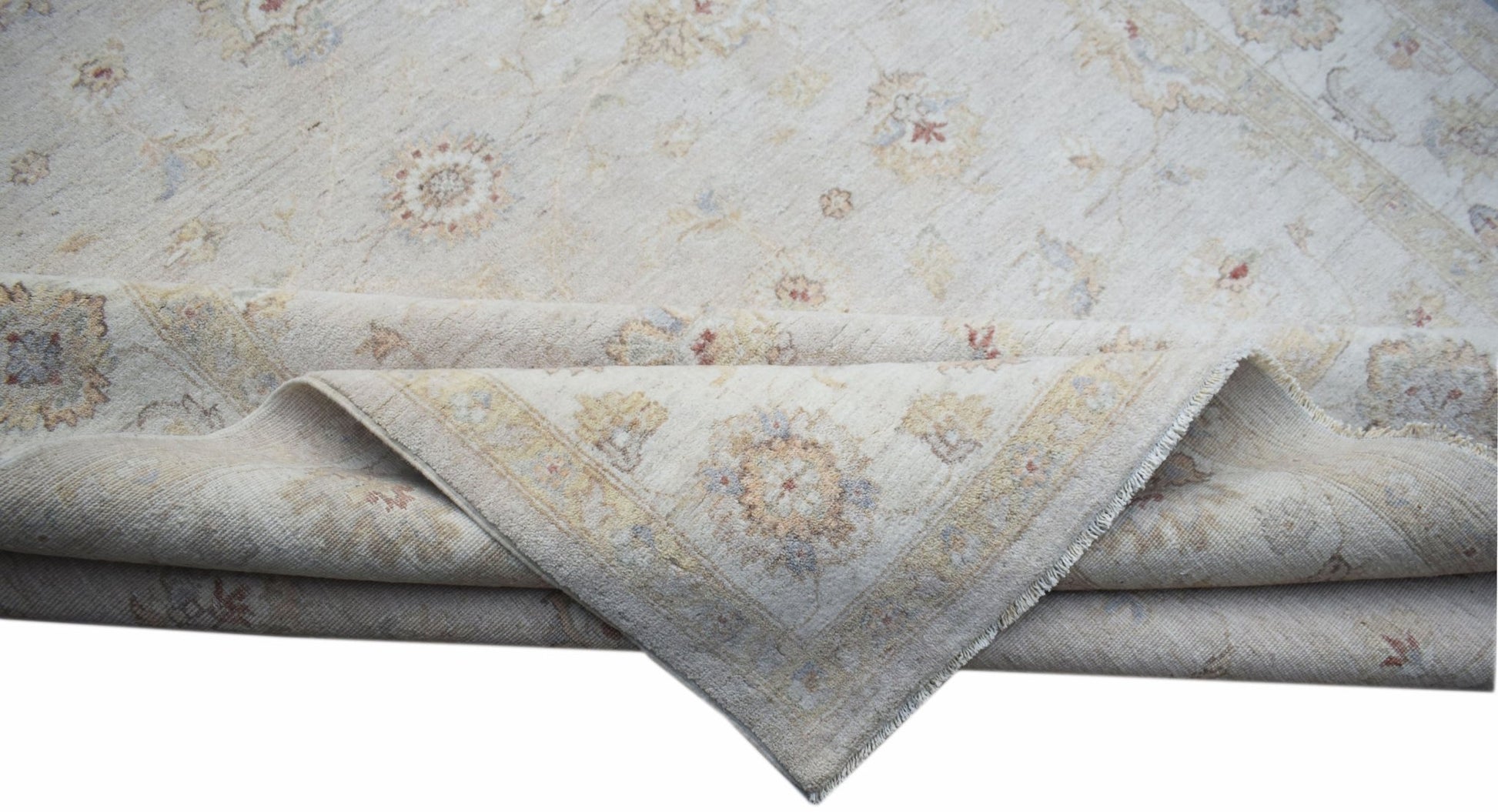 A handwoven Afghan Chobi rug featuring a traditional floral pattern in soft, neutral wood tones.