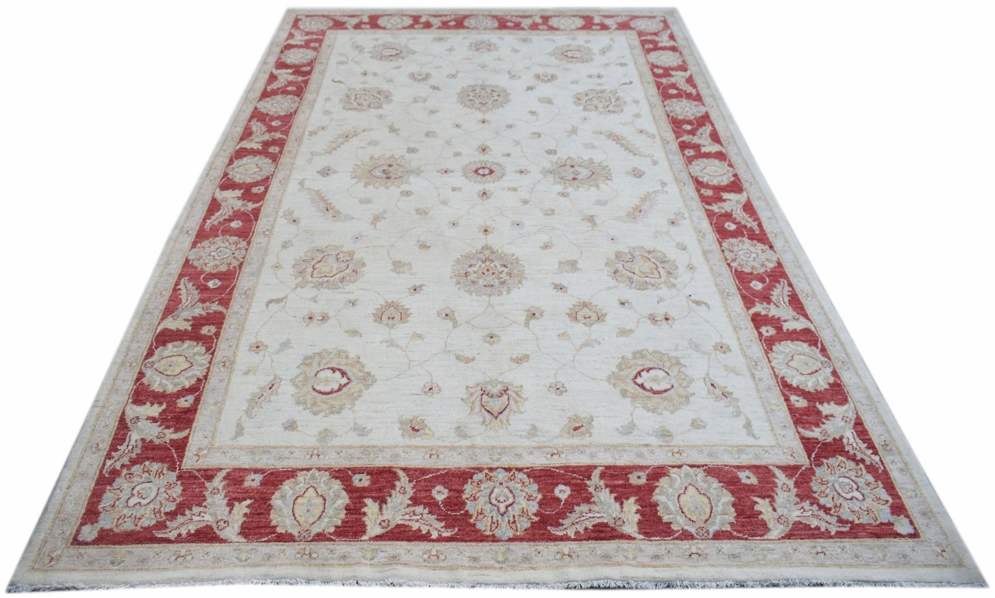 Handwoven Afghan Chobi rug featuring a cream field with floral motifs and a red border.