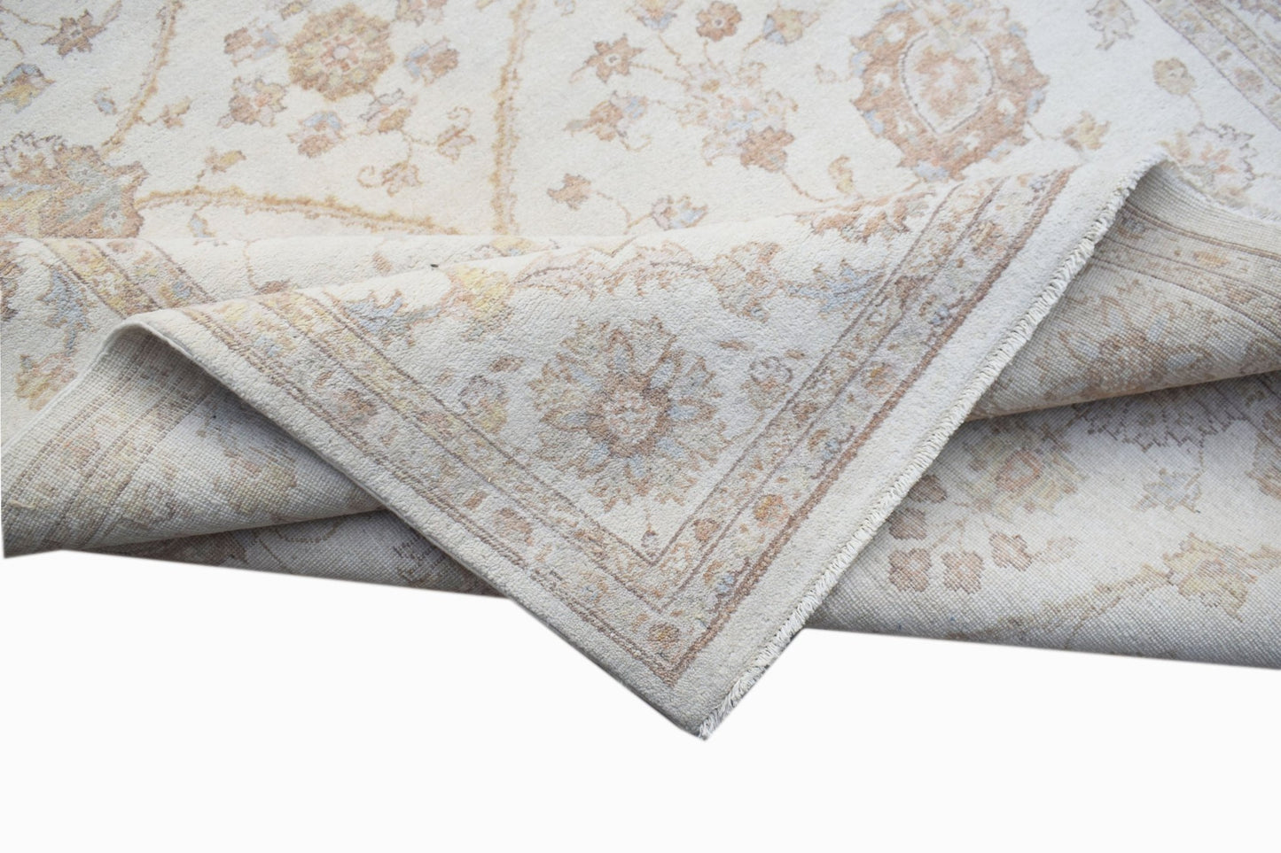 A handwoven Afghan Chobi rug featuring a traditional floral pattern in soft, earthy tones.