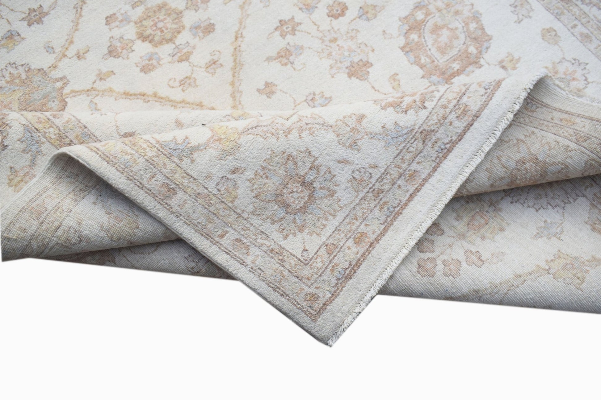 A handwoven Afghan Chobi rug featuring a traditional floral pattern in soft, earthy tones.