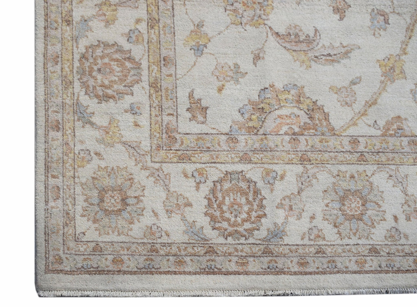 A handwoven Afghan Chobi rug featuring a traditional floral pattern in soft, earthy wood tones.