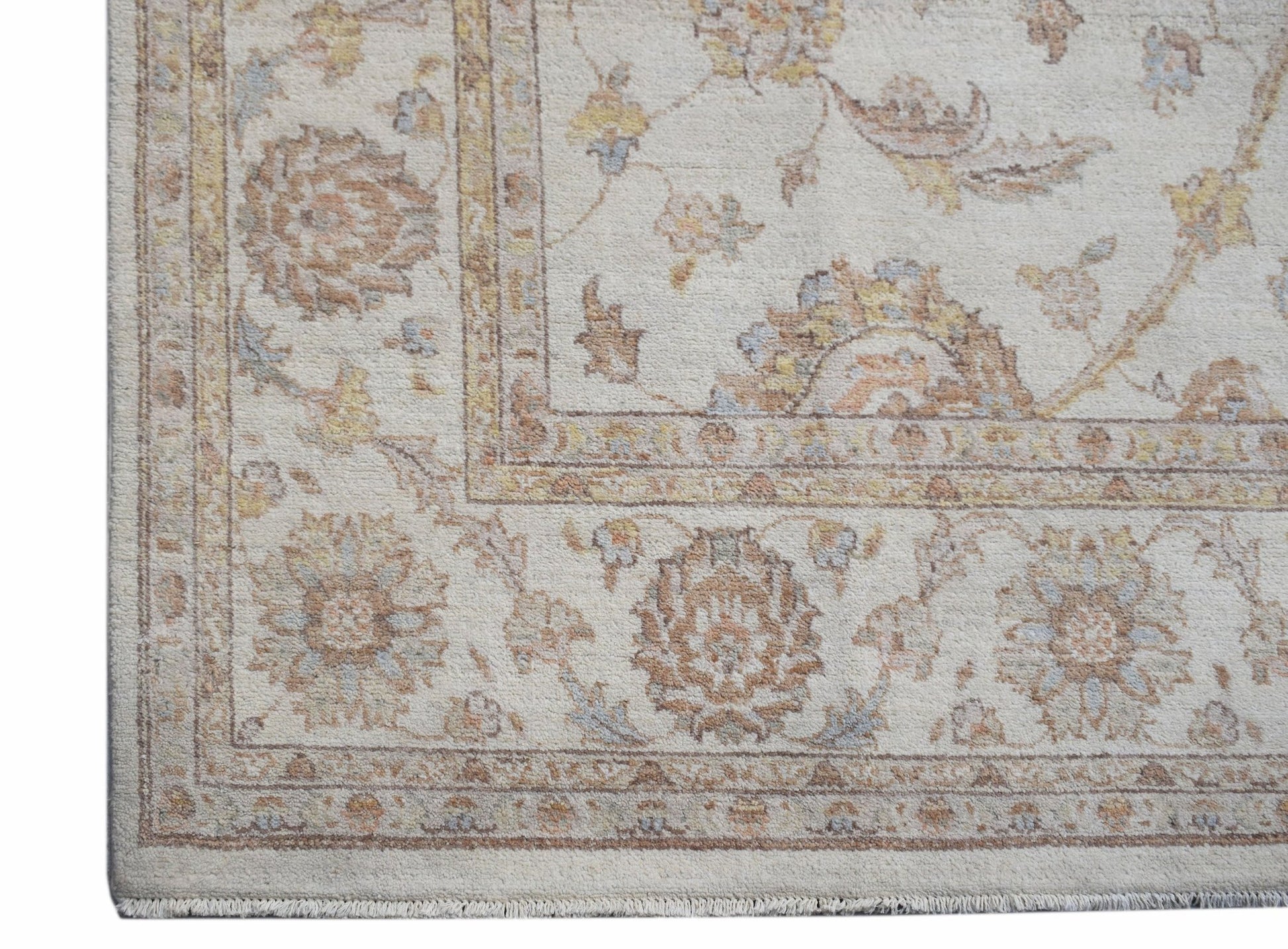 A handwoven Afghan Chobi rug featuring a traditional floral pattern in soft, earthy wood tones.