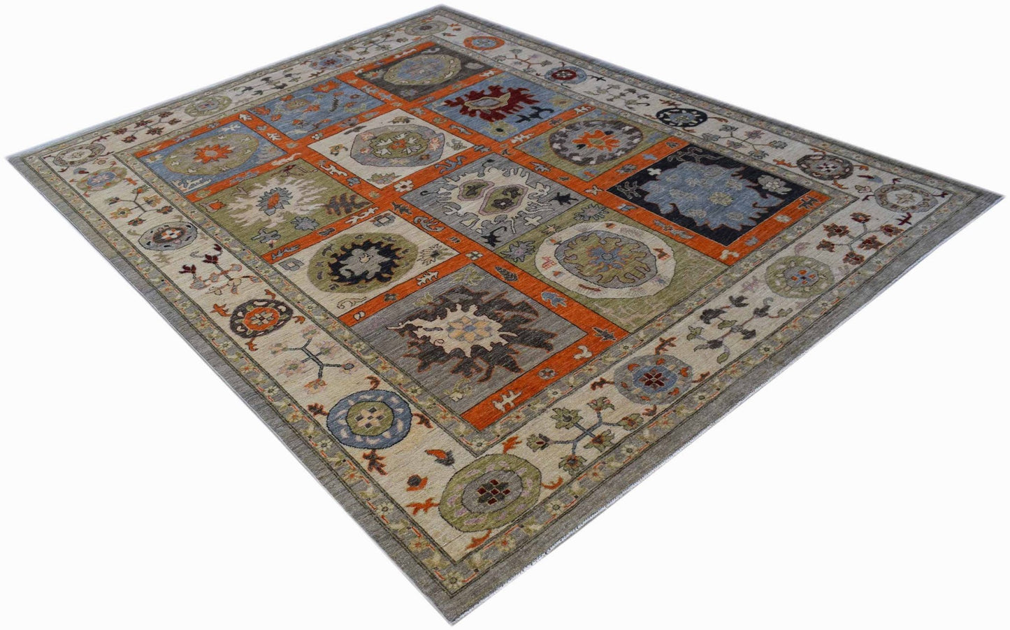 Handwoven Afghan Chobi rug featuring a geometric patchwork design in earthy tones.