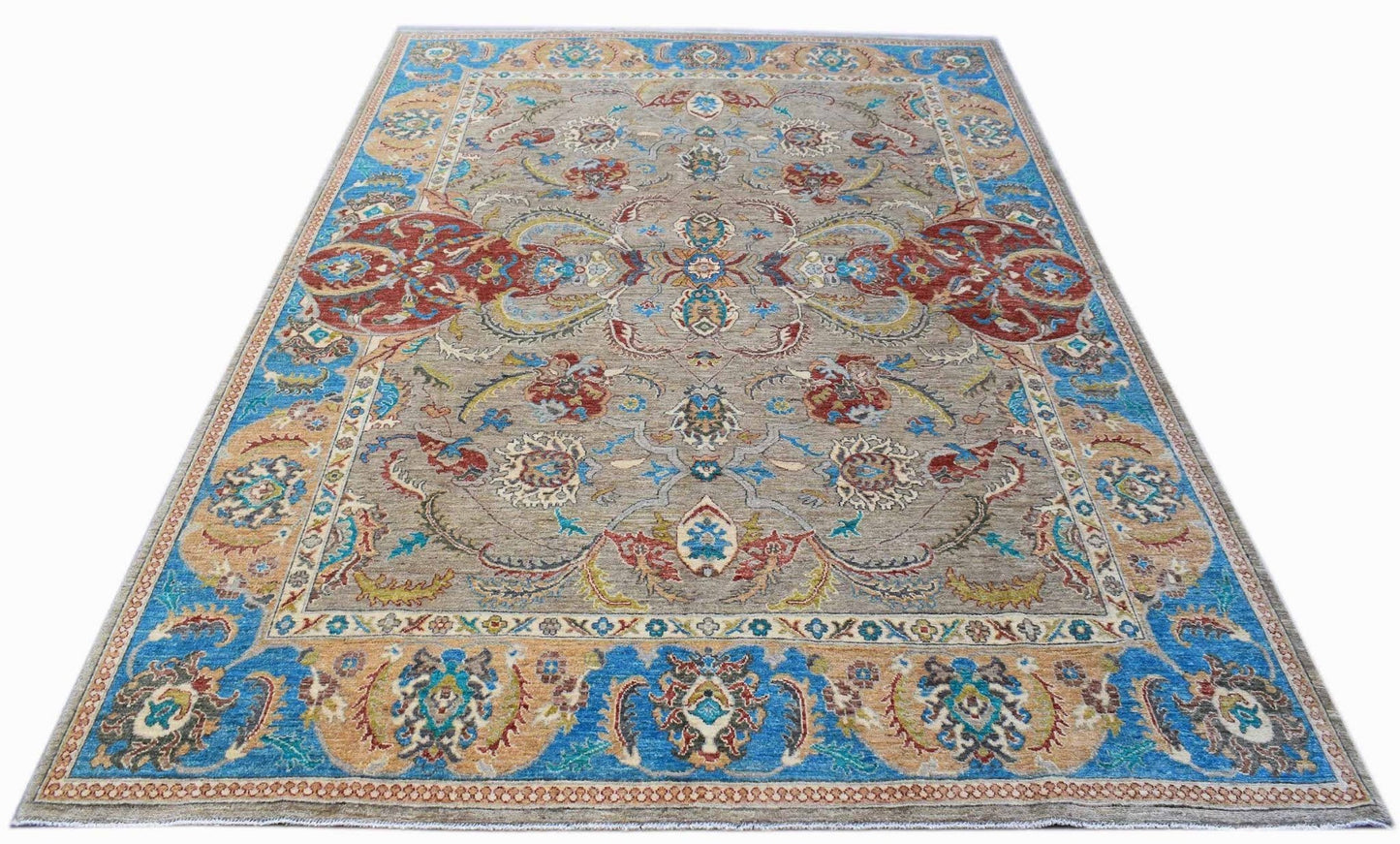 A rectangular Afghan Chobi rug featuring a traditional floral pattern in blue, red, and tan tones.