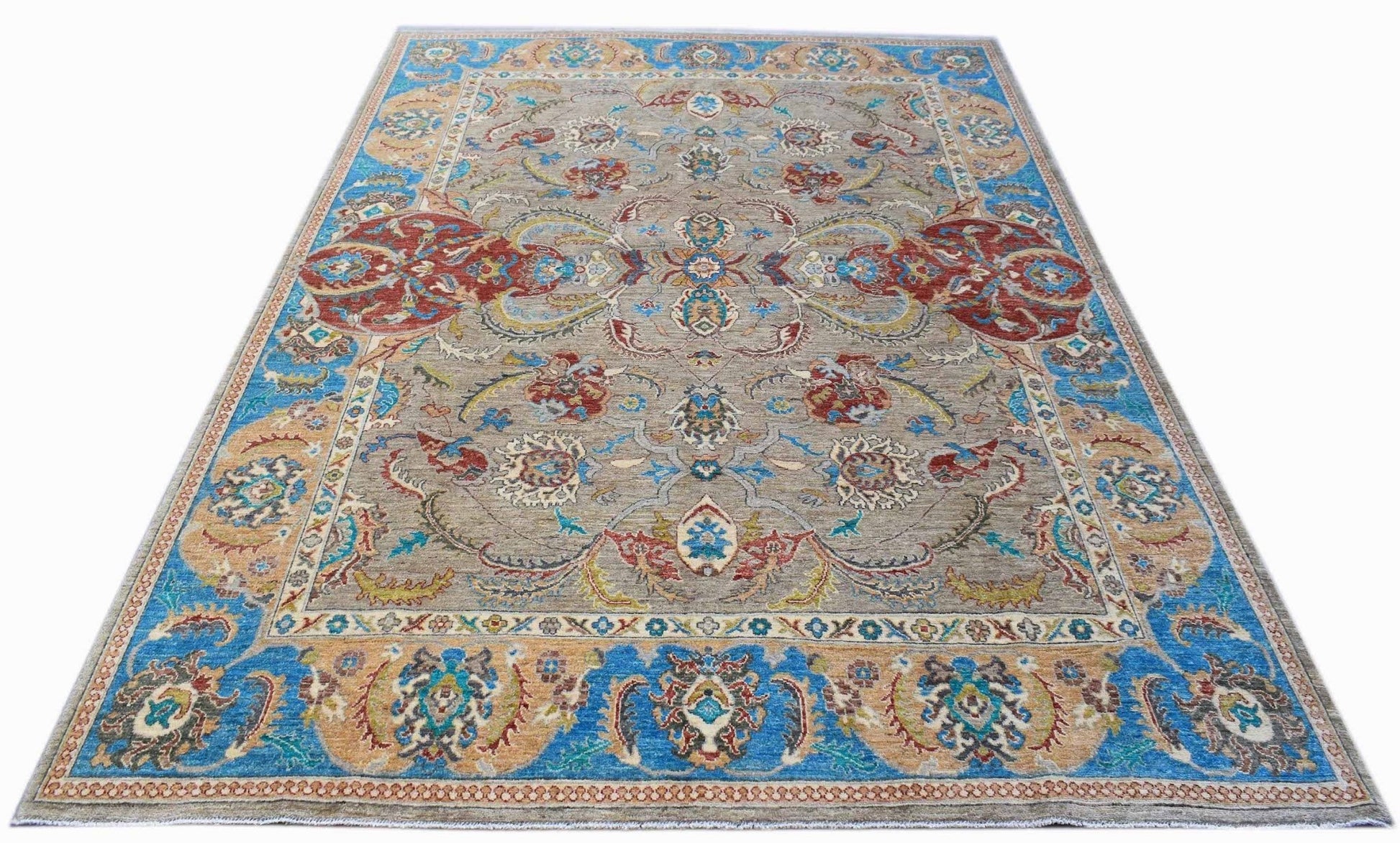 A rectangular Afghan Chobi rug featuring a traditional floral pattern in blue, red, and tan tones.