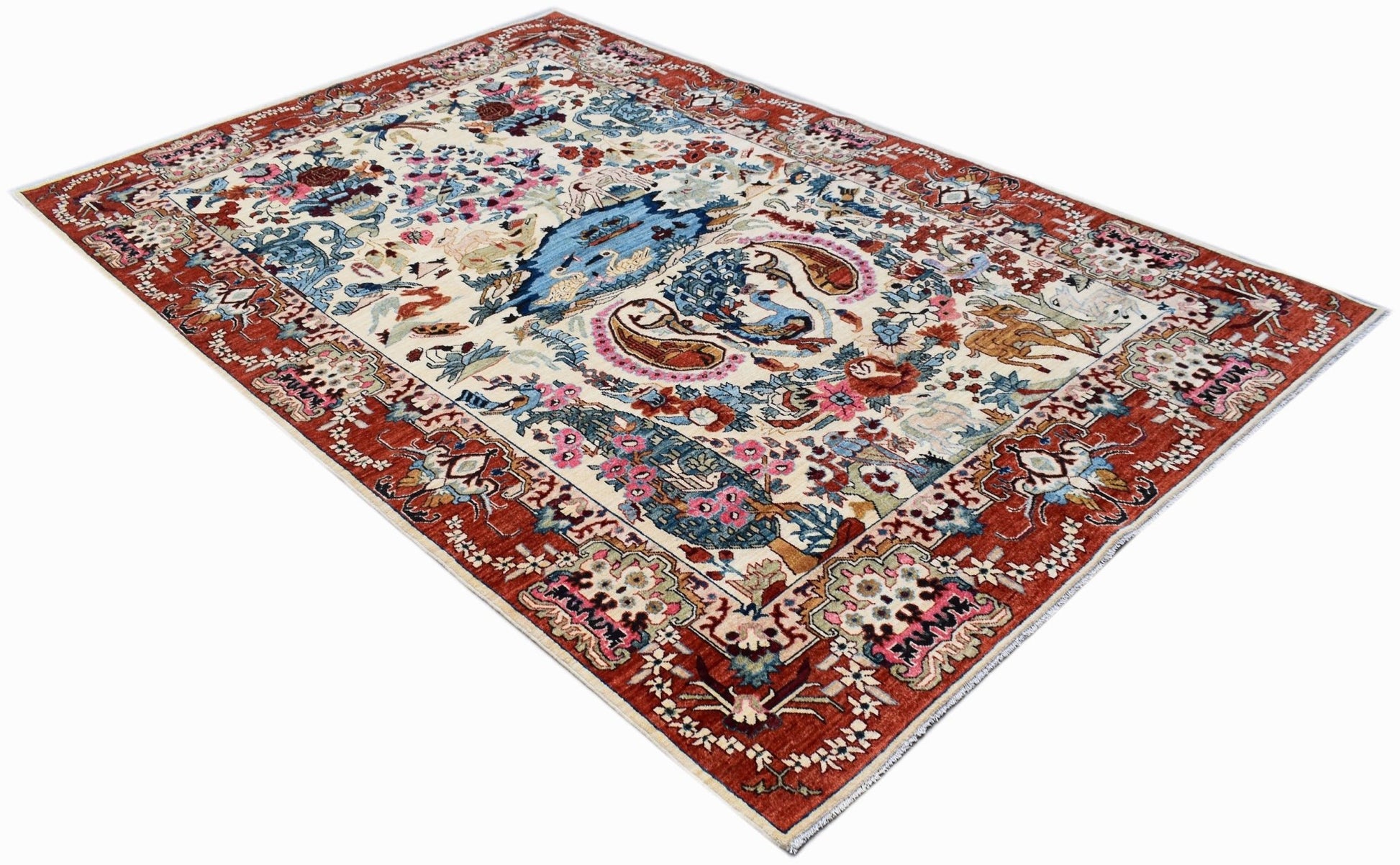 An Afghan Chobi rug featuring a traditional hunting scene with intricate floral and animal motifs.