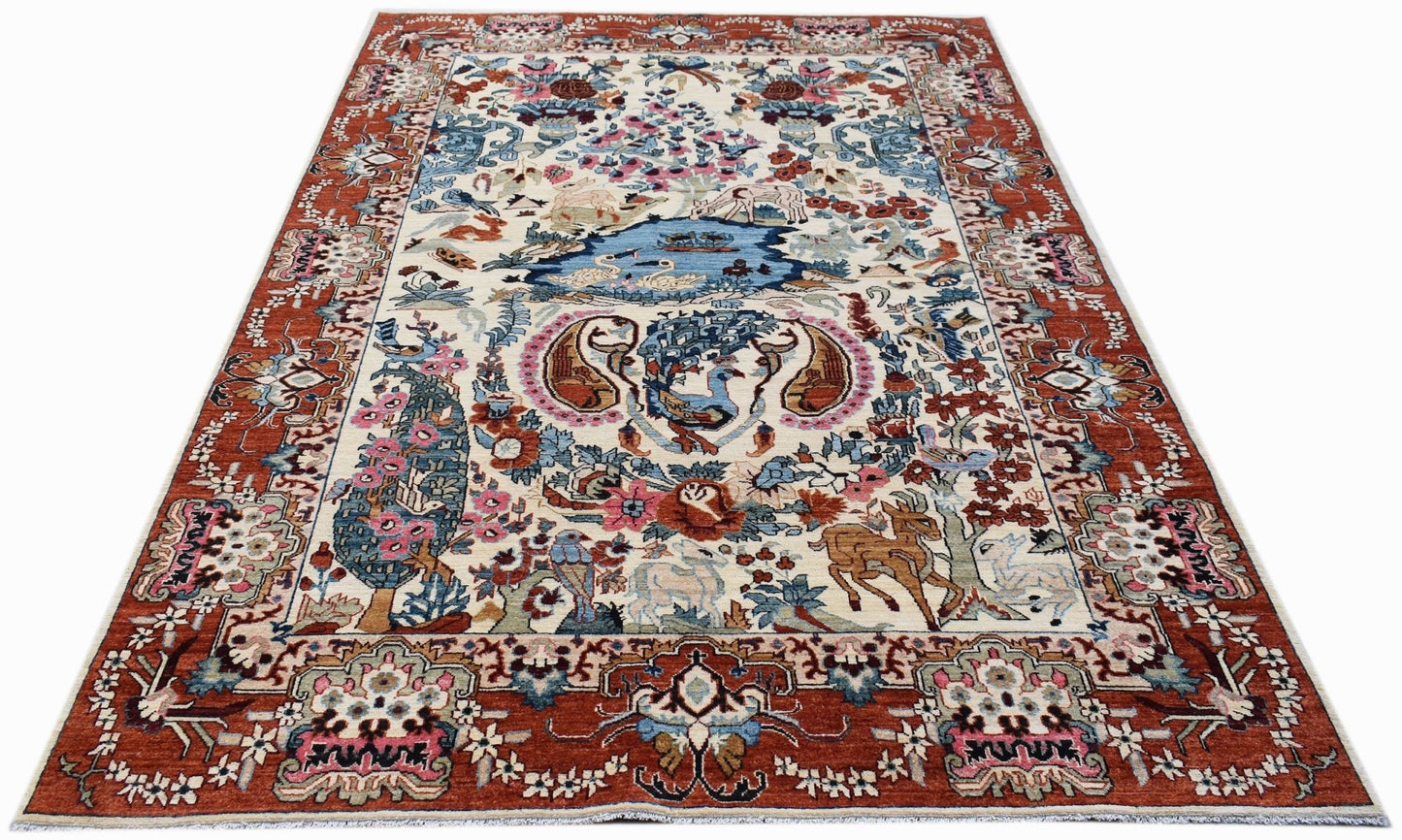 Handmade Afghan Chobi rug featuring a traditional hunting scene with animals and floral motifs.